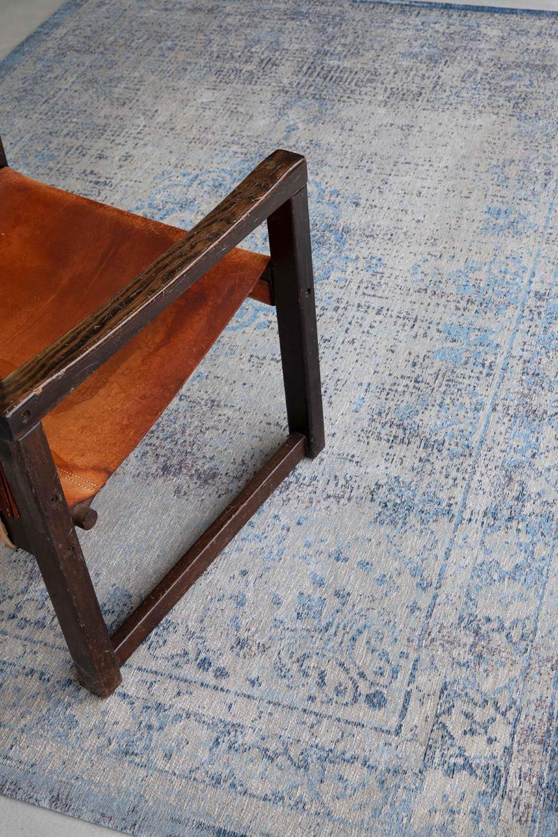 blue and grey flatweave rug with traditional medallion design
