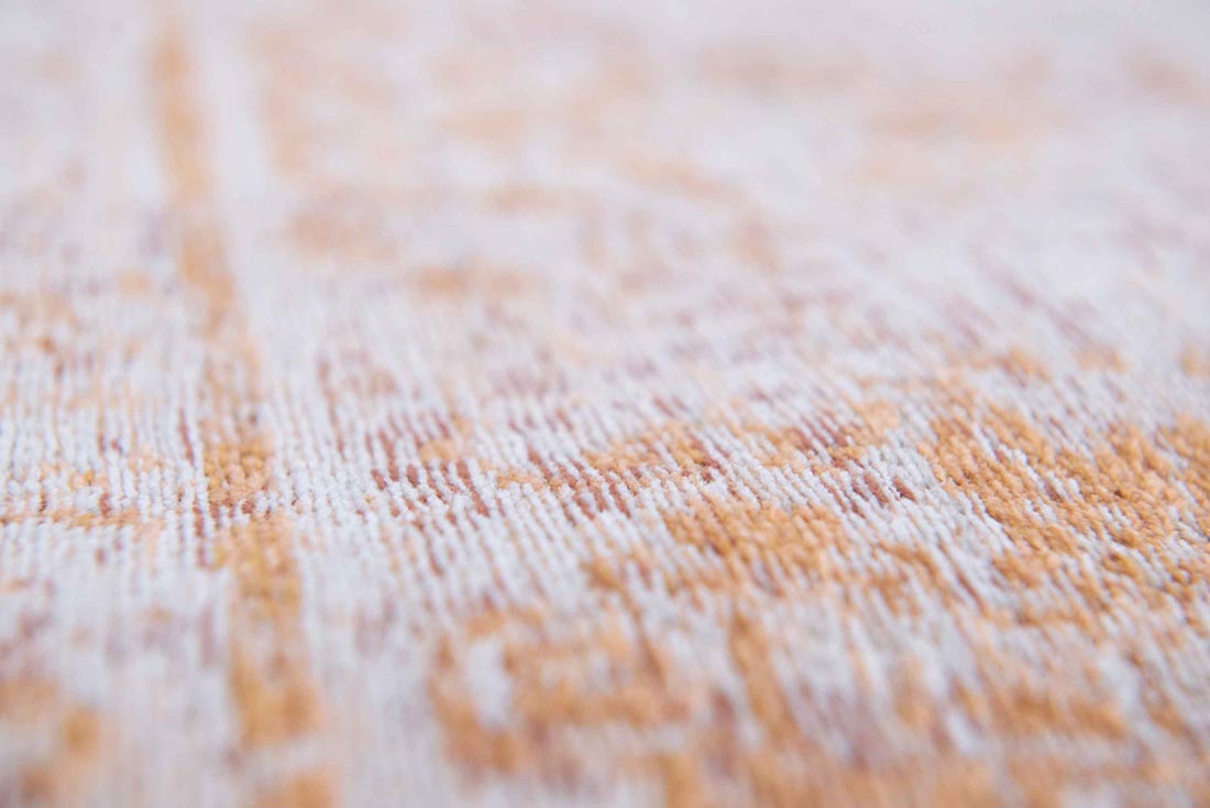 faded orange flatweave rug with traditional medallion design