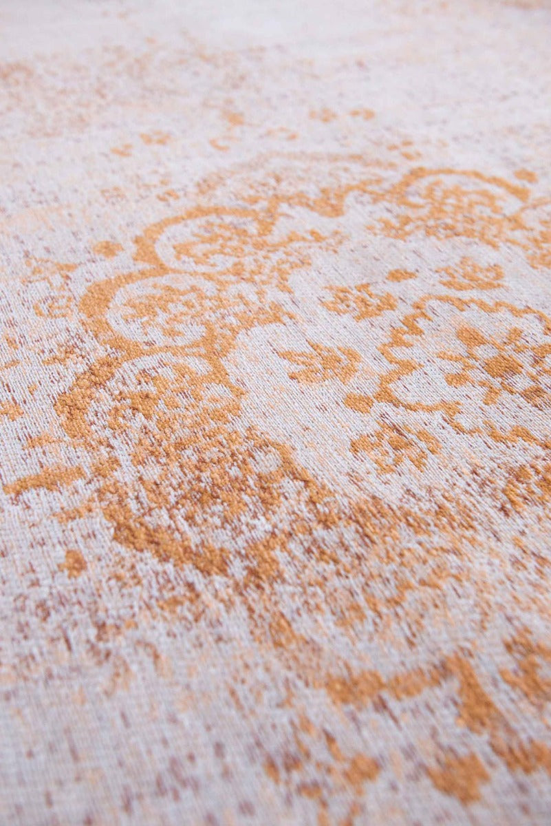 faded orange flatweave rug with traditional medallion design