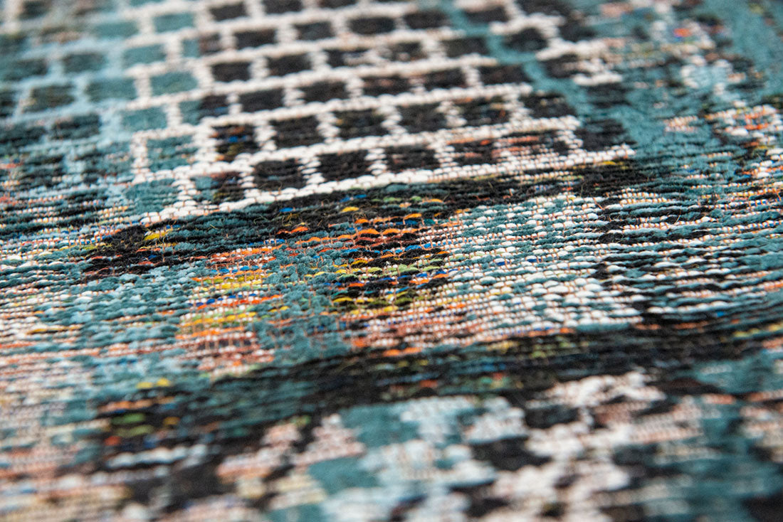 blue rug with a moroccan geometric pattern