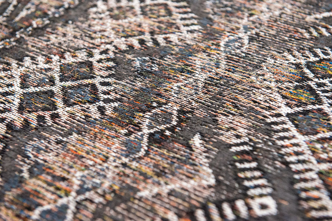 brown rug with a moroccan geometric pattern