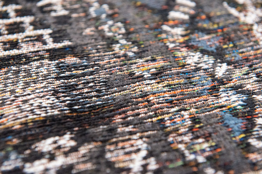 brown rug with a moroccan geometric pattern