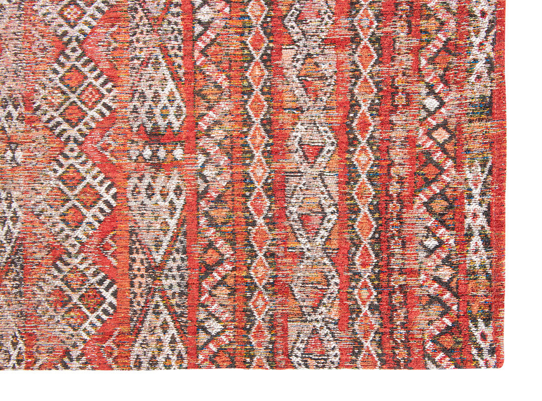 red rug with a moroccan geometric pattern