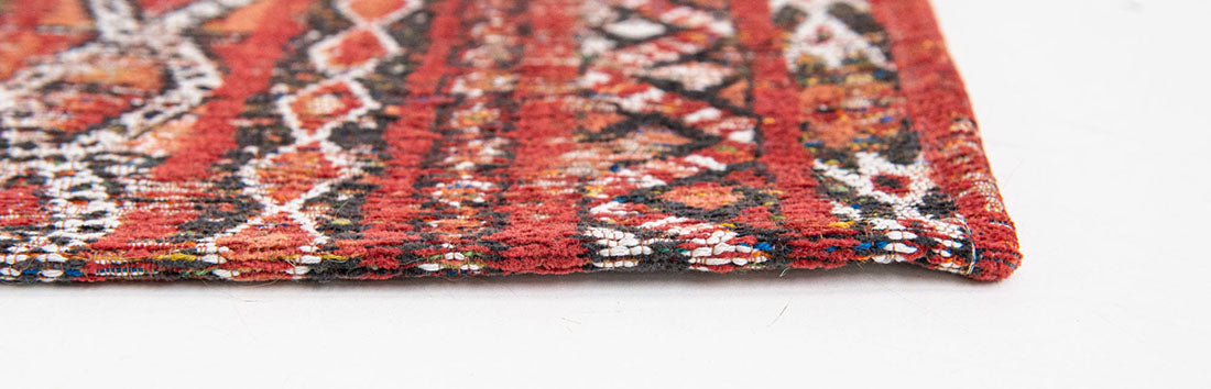 red rug with a moroccan geometric pattern