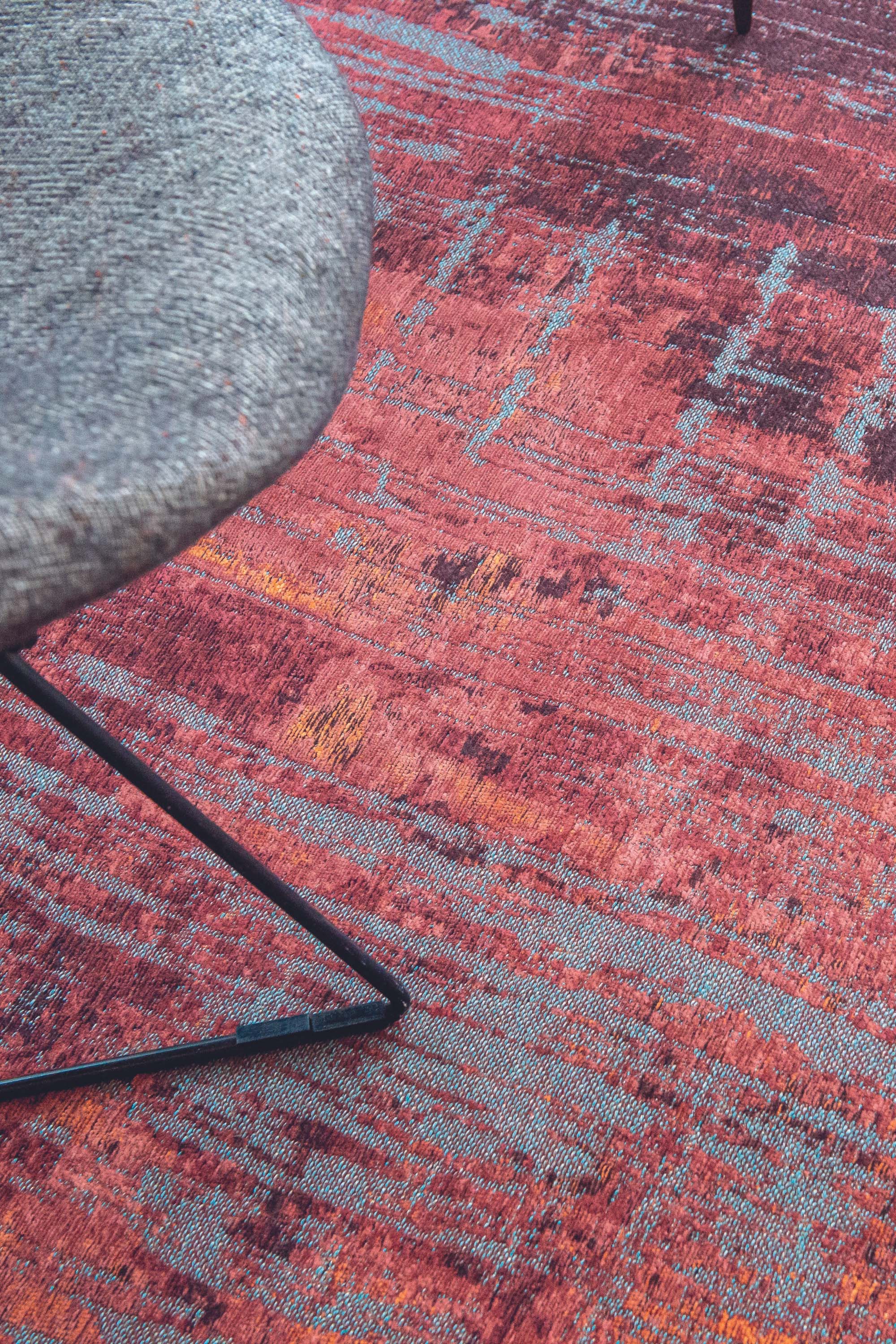 red, orange and blue abstract rug