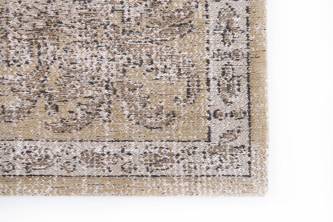 beige vintage style rug with a traditional design