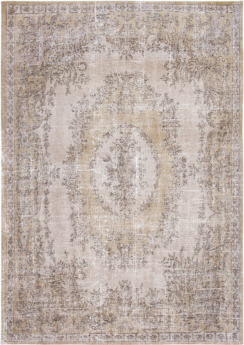 beige vintage style rug with a traditional design