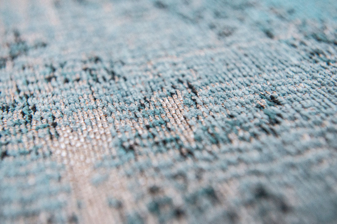 blue vintage style rug with a traditional design