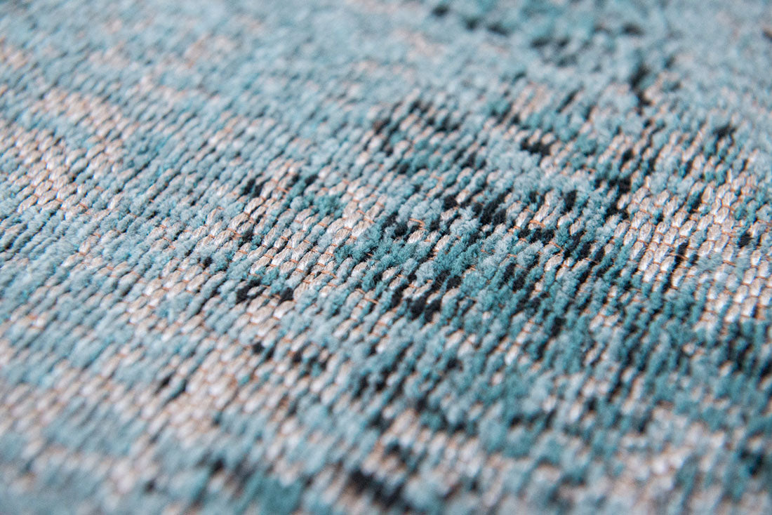 blue vintage style rug with a traditional design