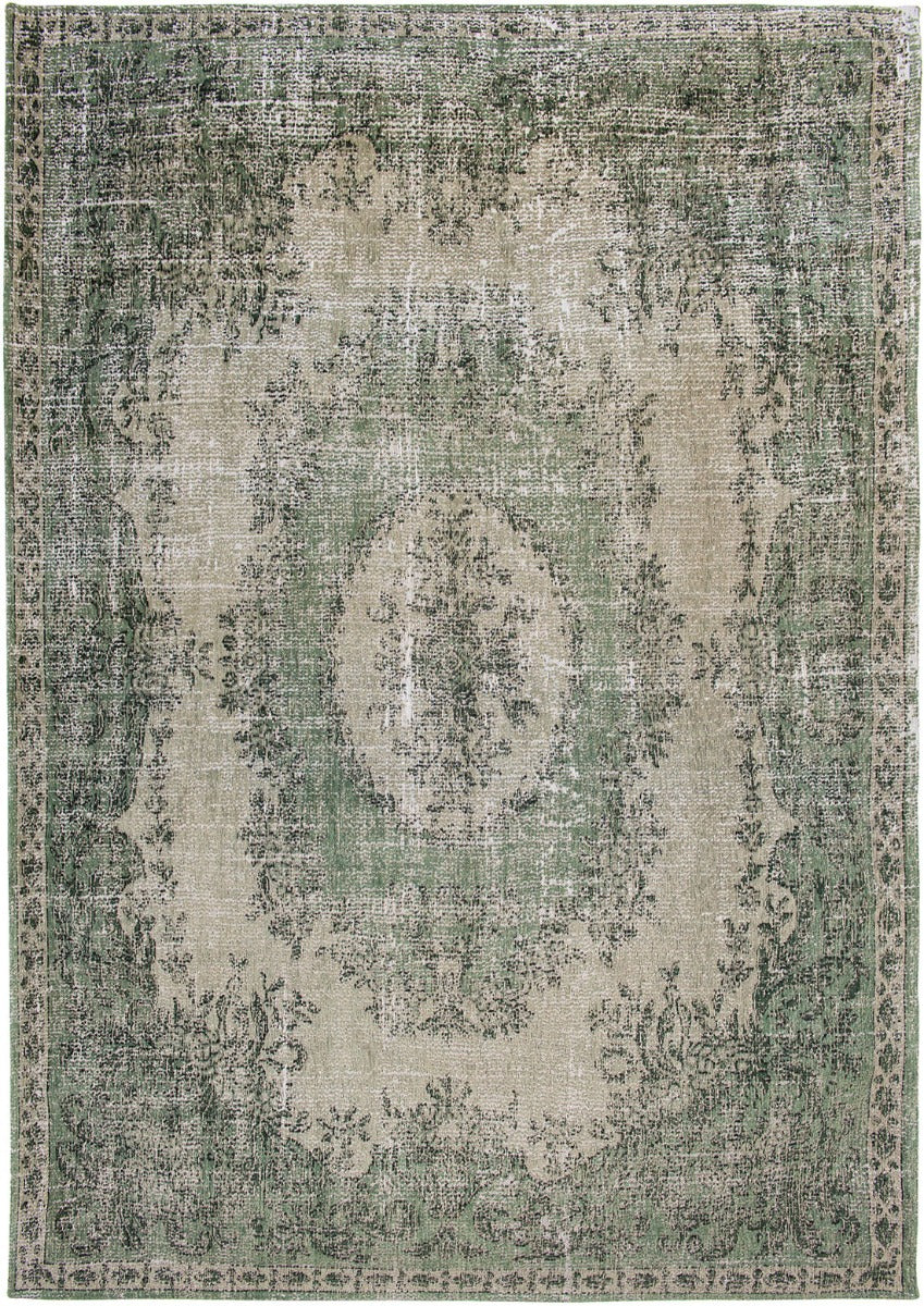 green vintage style rug with a traditional design