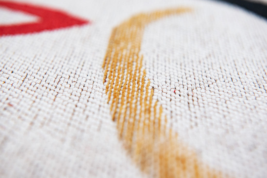 blue and red rug with an abstract face