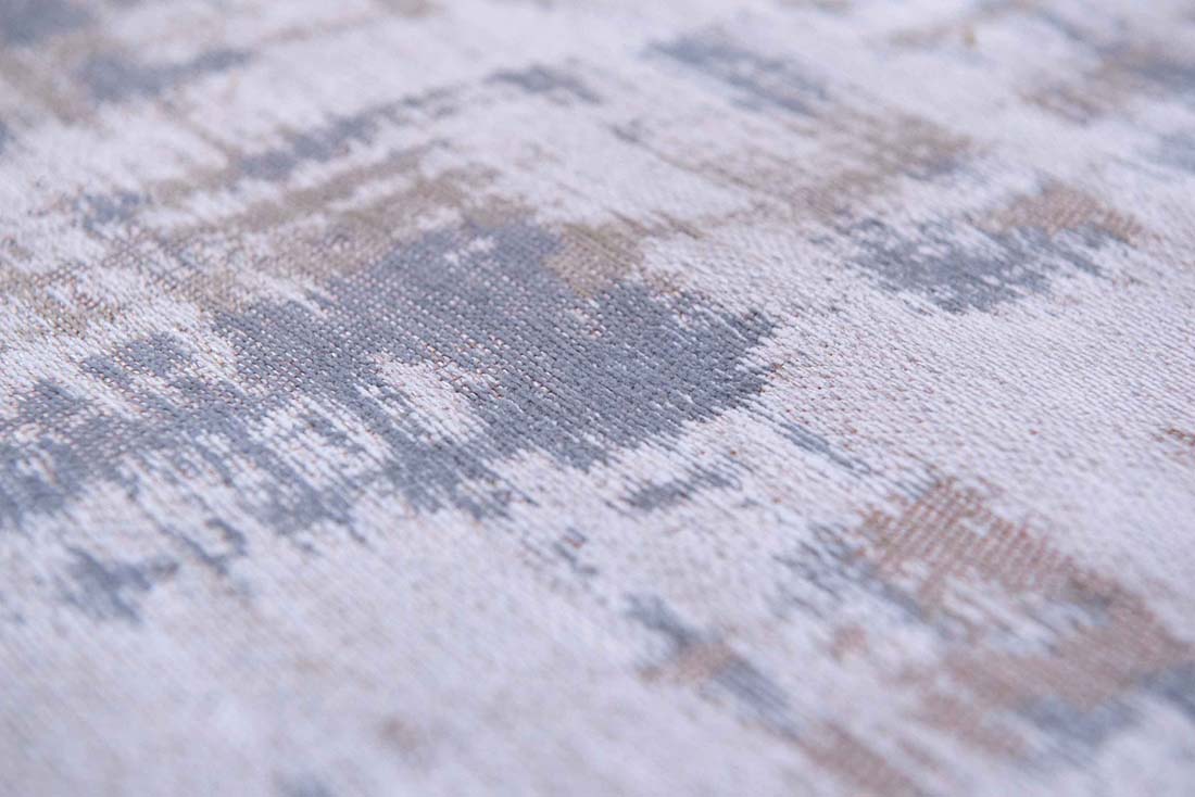 beige flatweave rug with modern abstract design