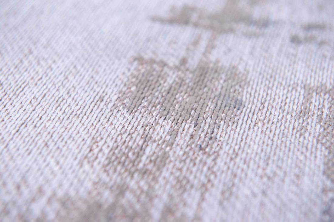 beige flatweave rug with modern abstract design