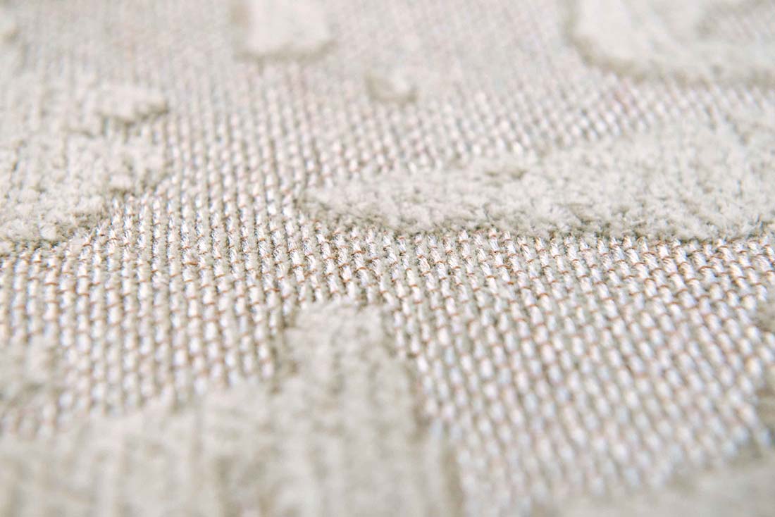 beige flatweave area rug with subtle