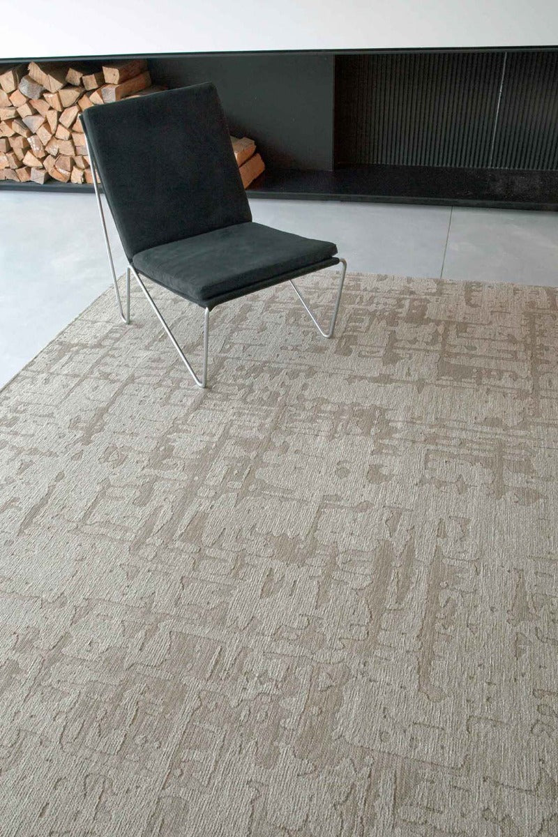 beige flatweave area rug with subtle