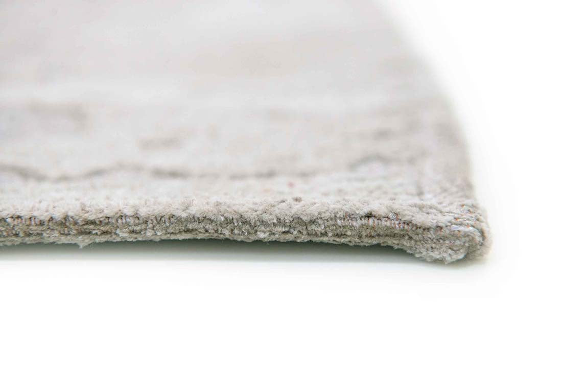 beige flatweave area rug with subtle