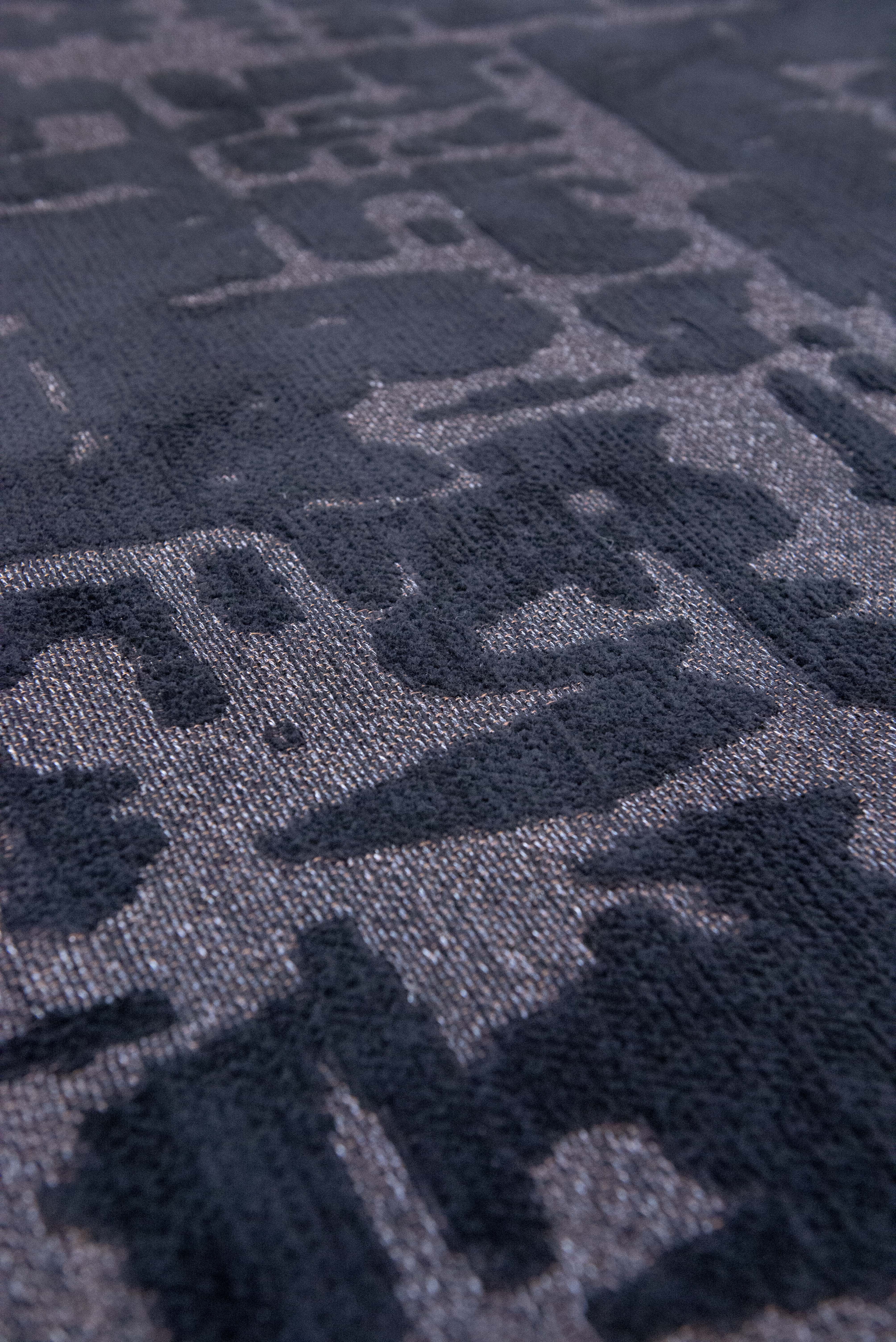Black flatweave area runner rug with subtle, organic pattern