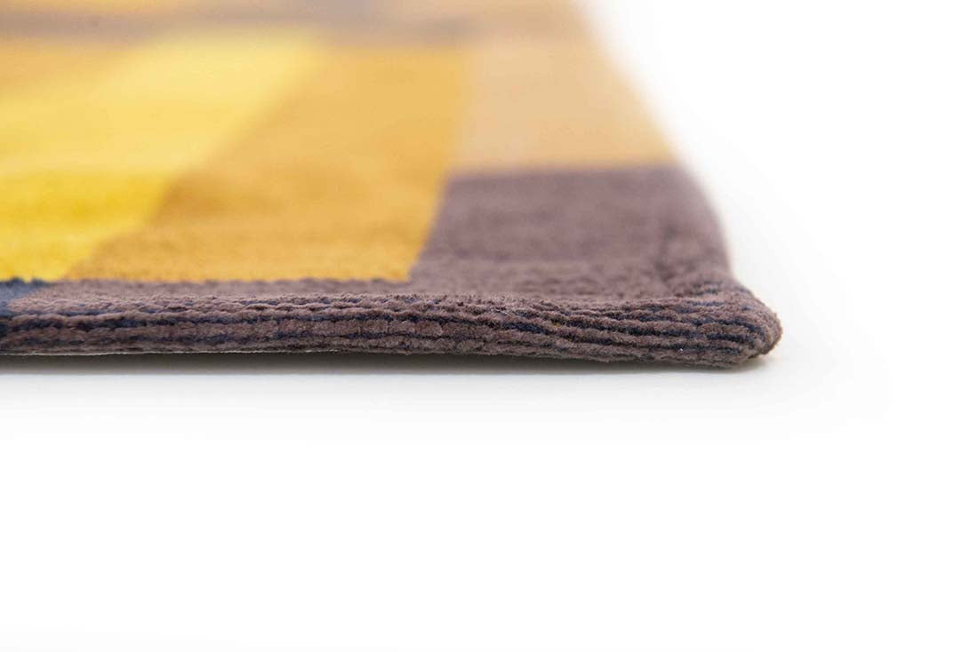 flatweave area rug with retro pattern in yellow