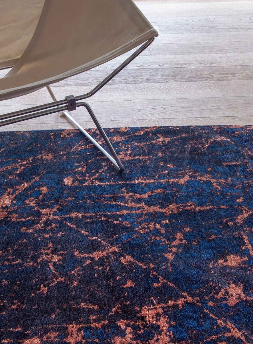navy and copper flatweave rug with modern abstract design

