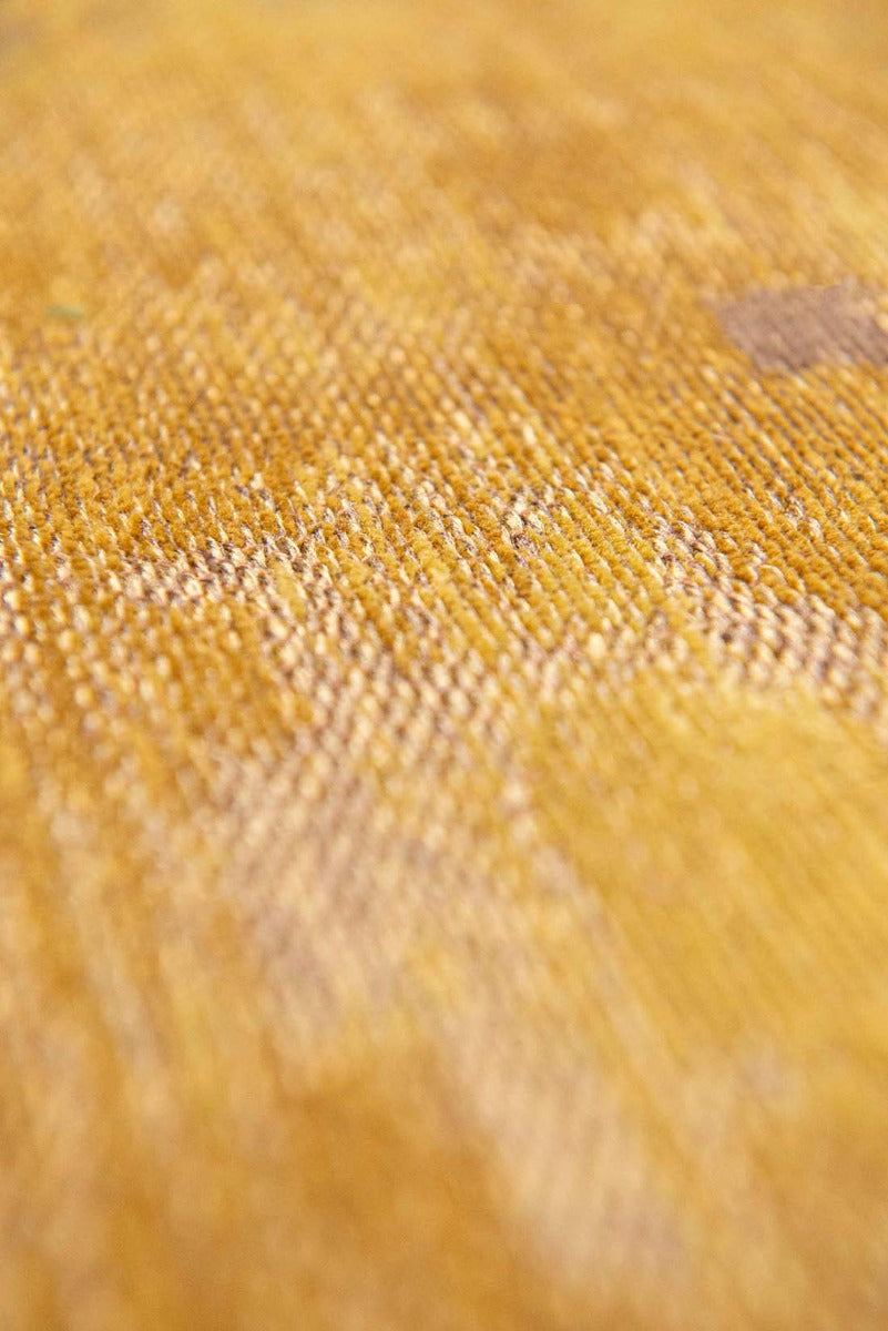 gold flatweave rug with modern abstract design