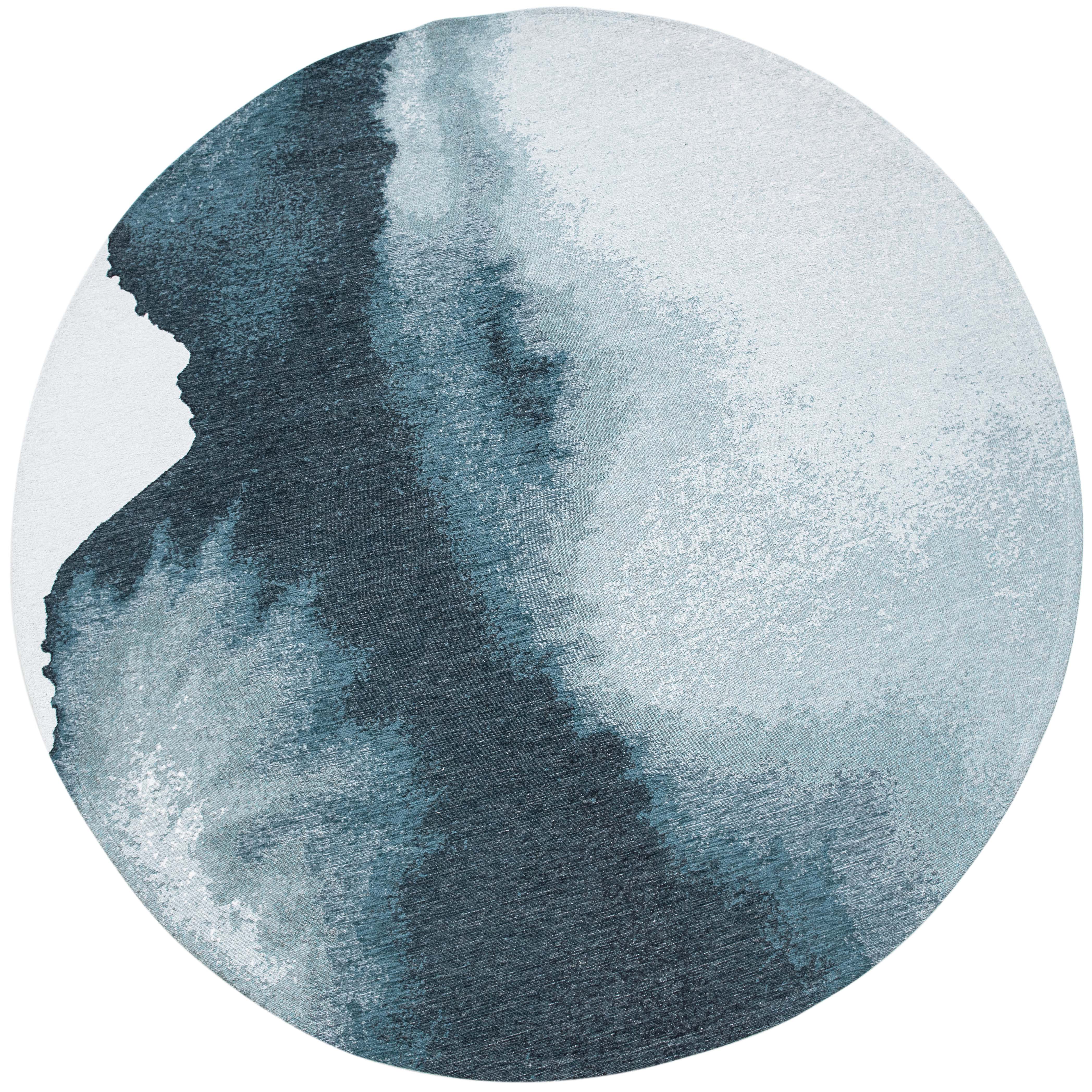 Modern circle rug with blue abstract shoreline pattern
