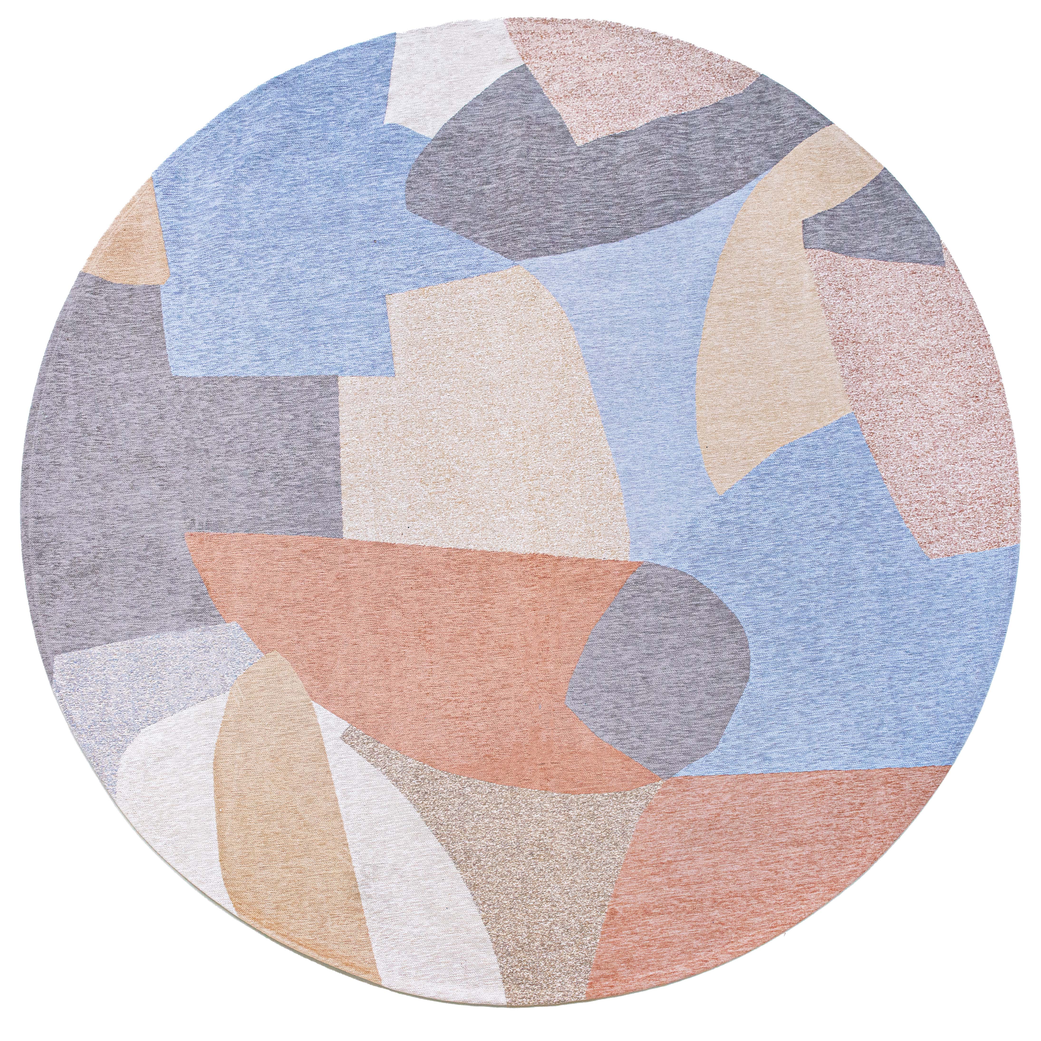 Modern circle rug with red, blue, white, and grey abstract pattern