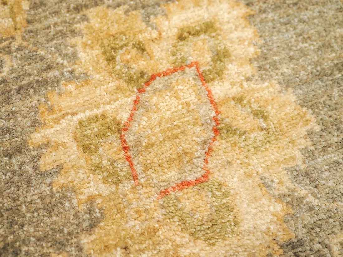 Authentic oriental rug with delicate floral pattern in beige