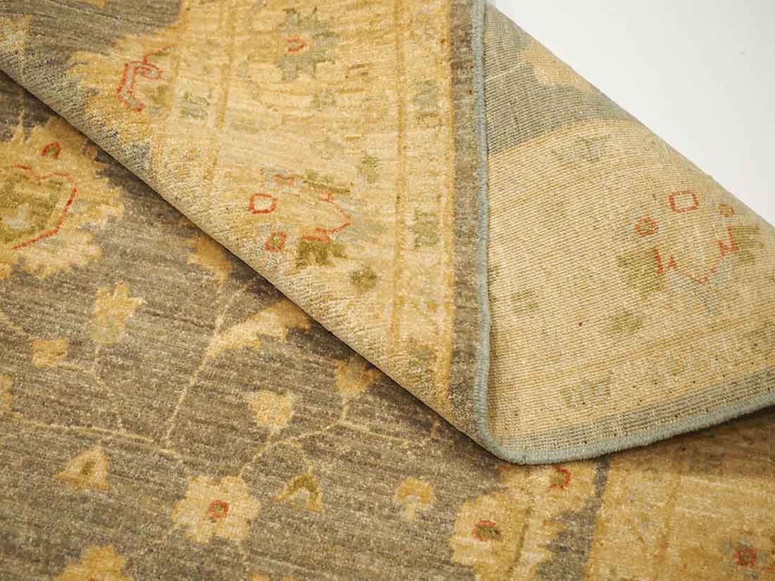 Authentic oriental rug with delicate floral pattern in beige