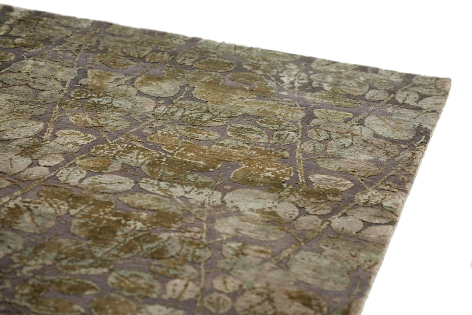 grey and taupe rug with an abstract damask pattern