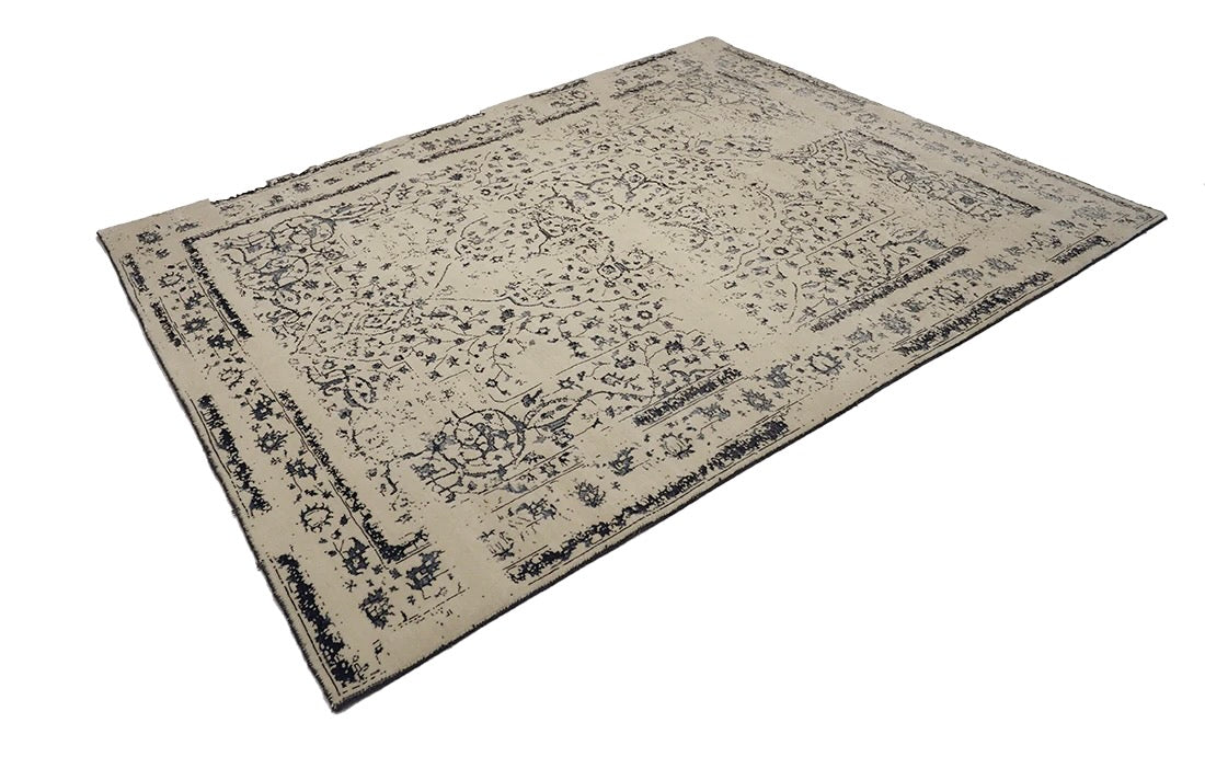cream and blue oriental rug with a floral design