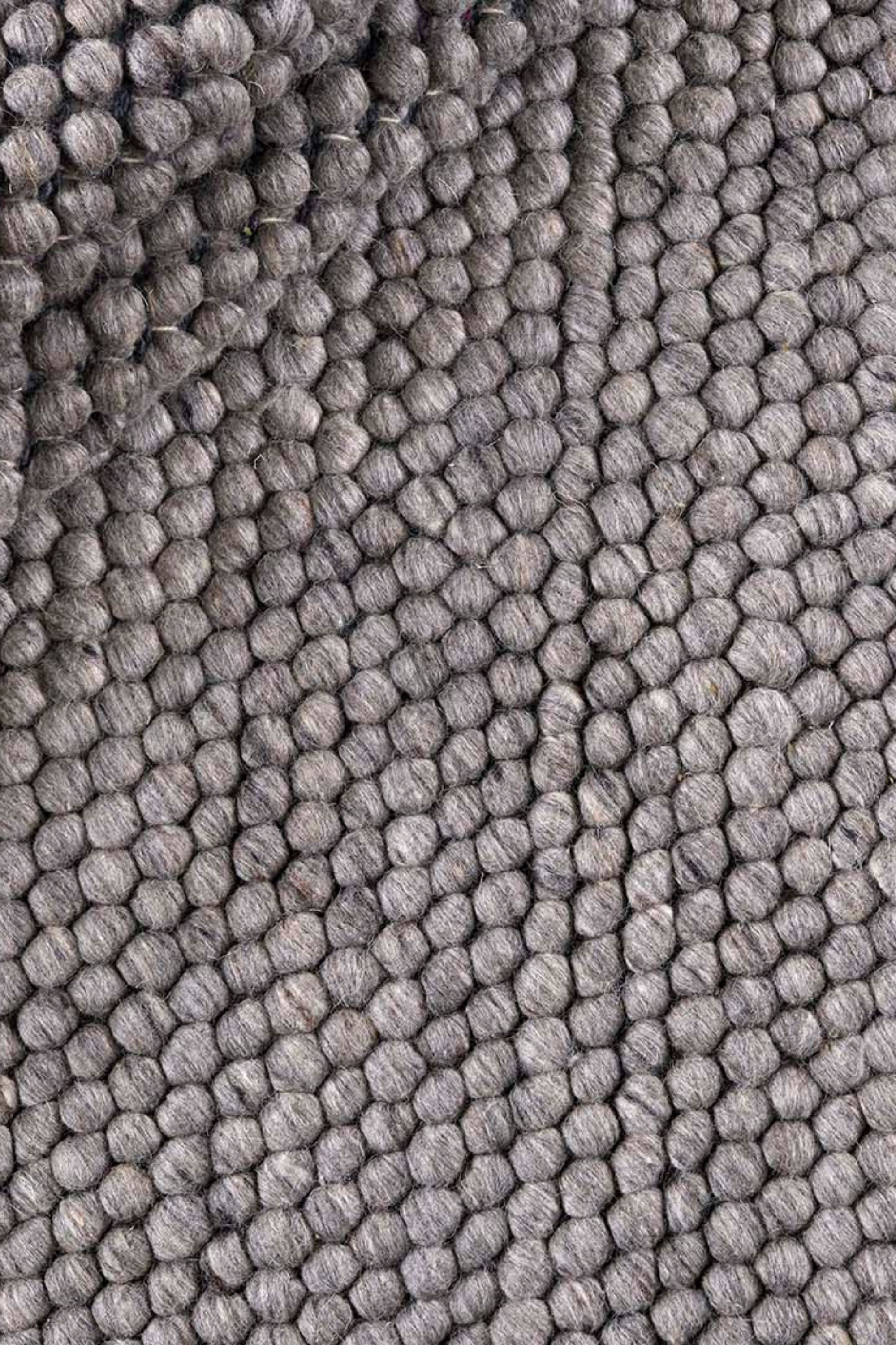 dark grey textured wool rug