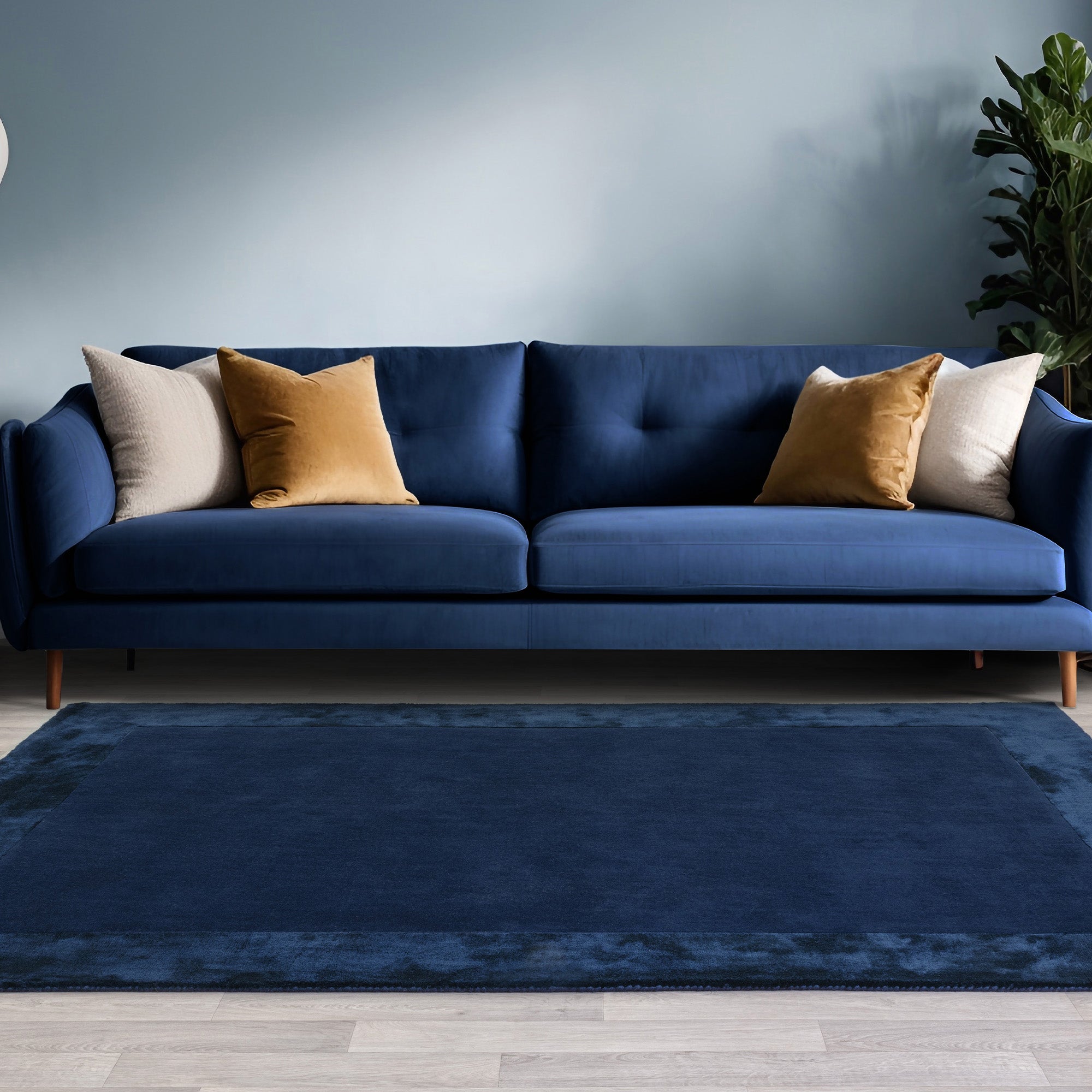 Navy wool and viscose rug with a border design