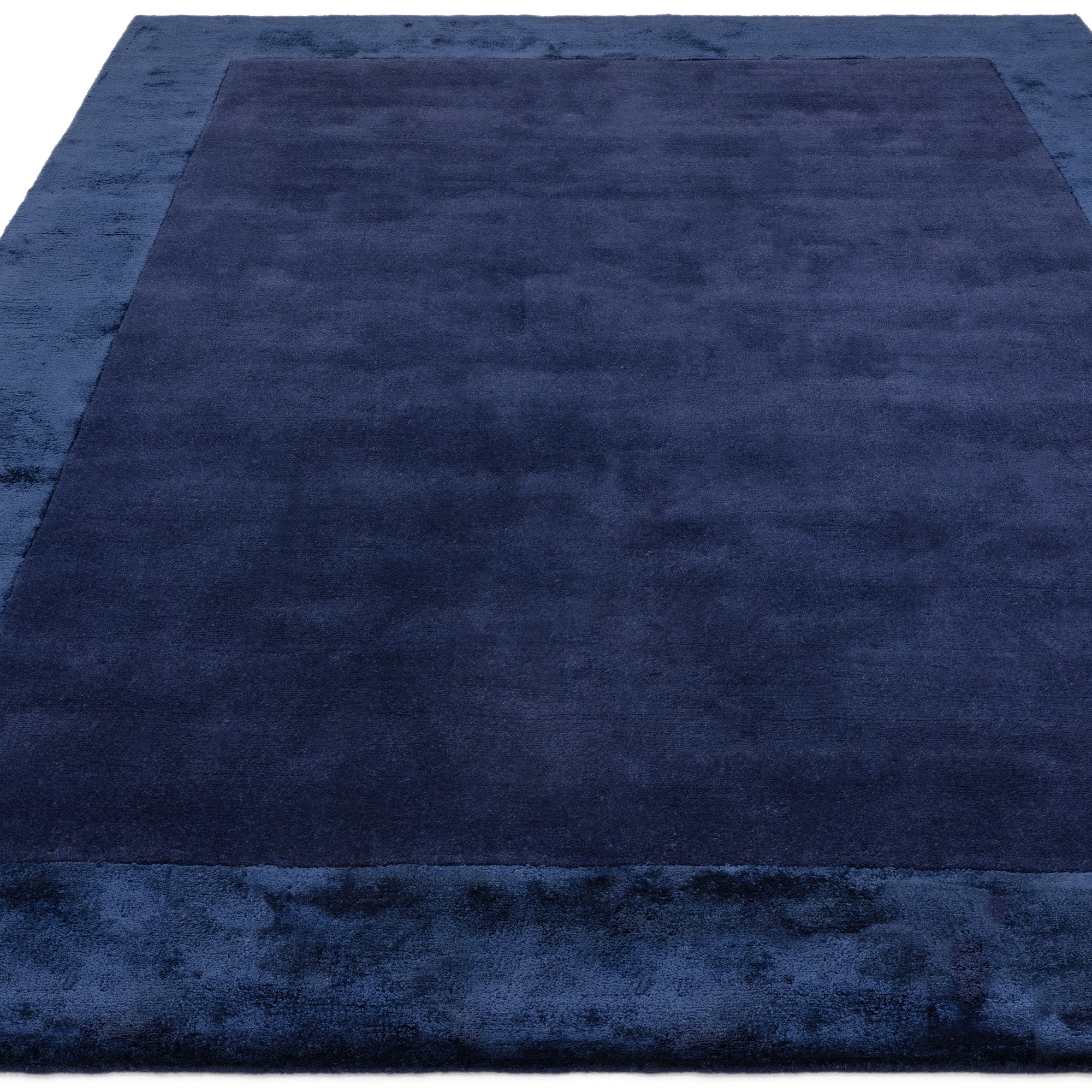 Navy wool and viscose rug with a border design