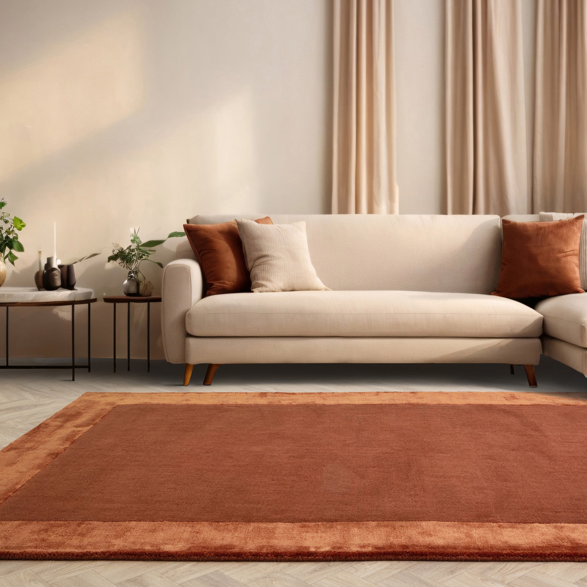 Orange wool and viscose rug with a border design