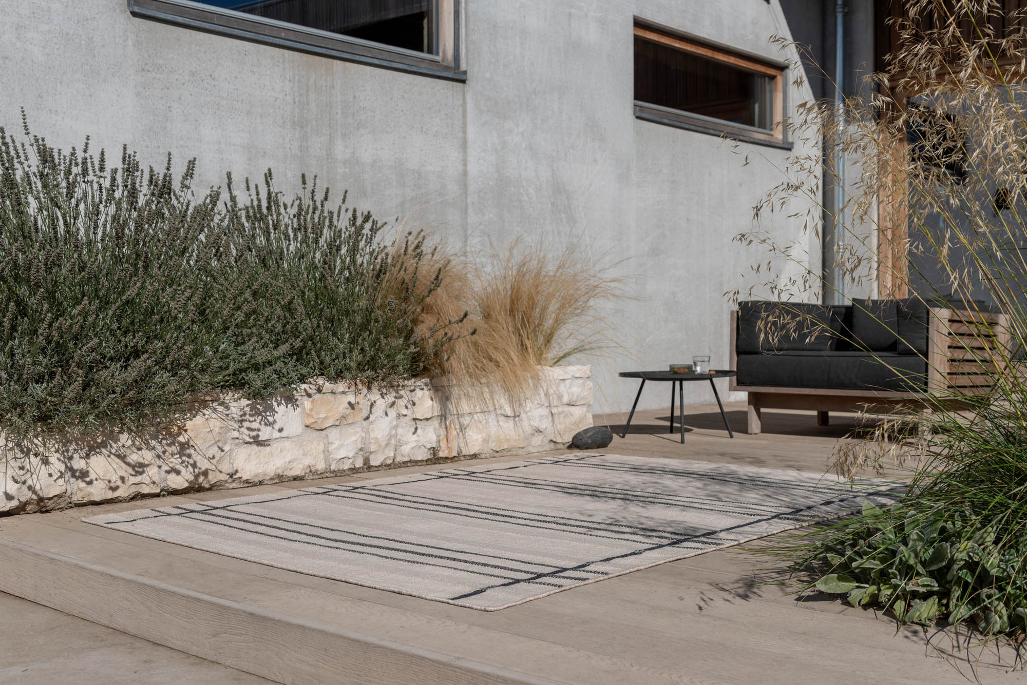 Modern beige geometric rug black pattern