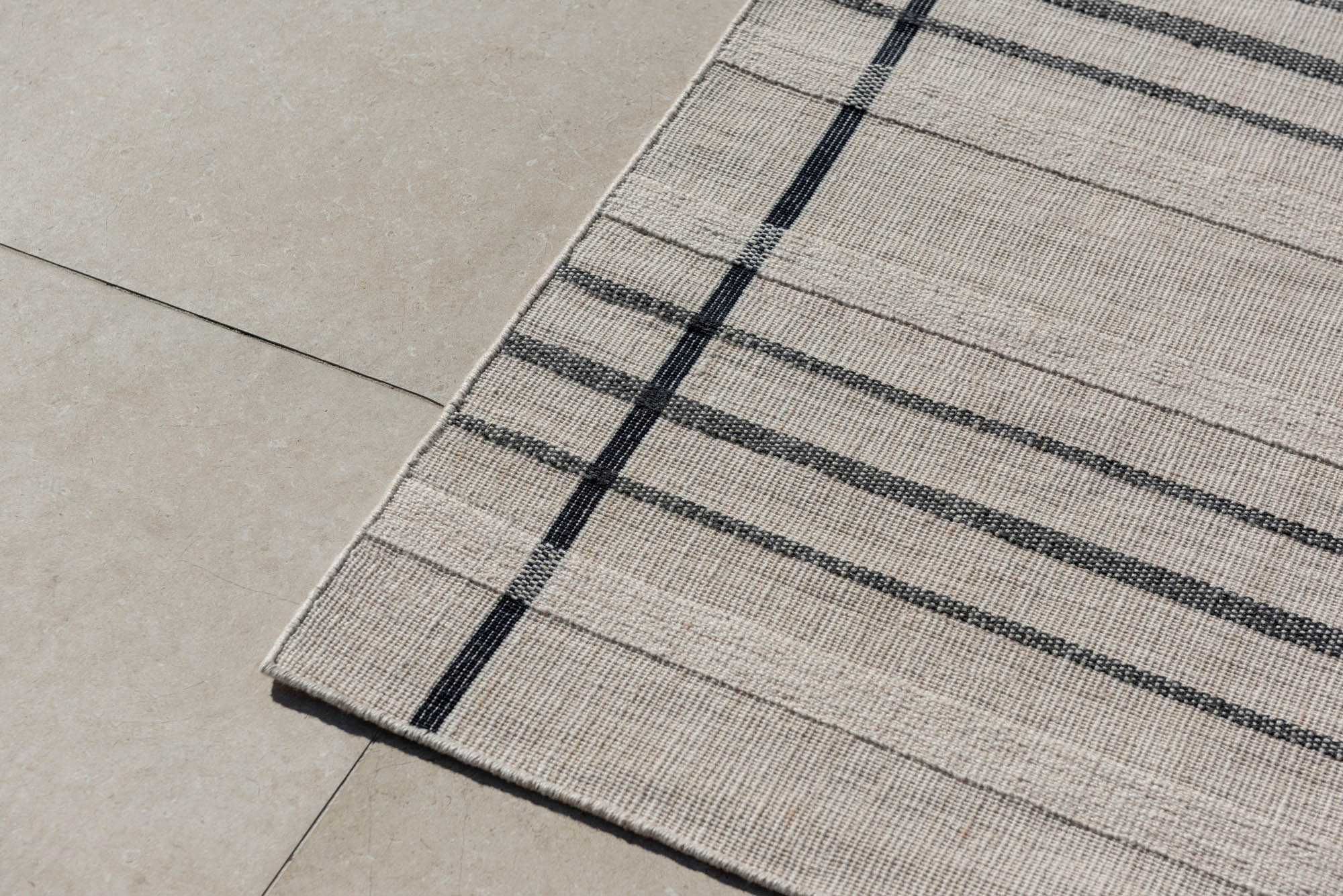 Modern beige geometric rug black pattern