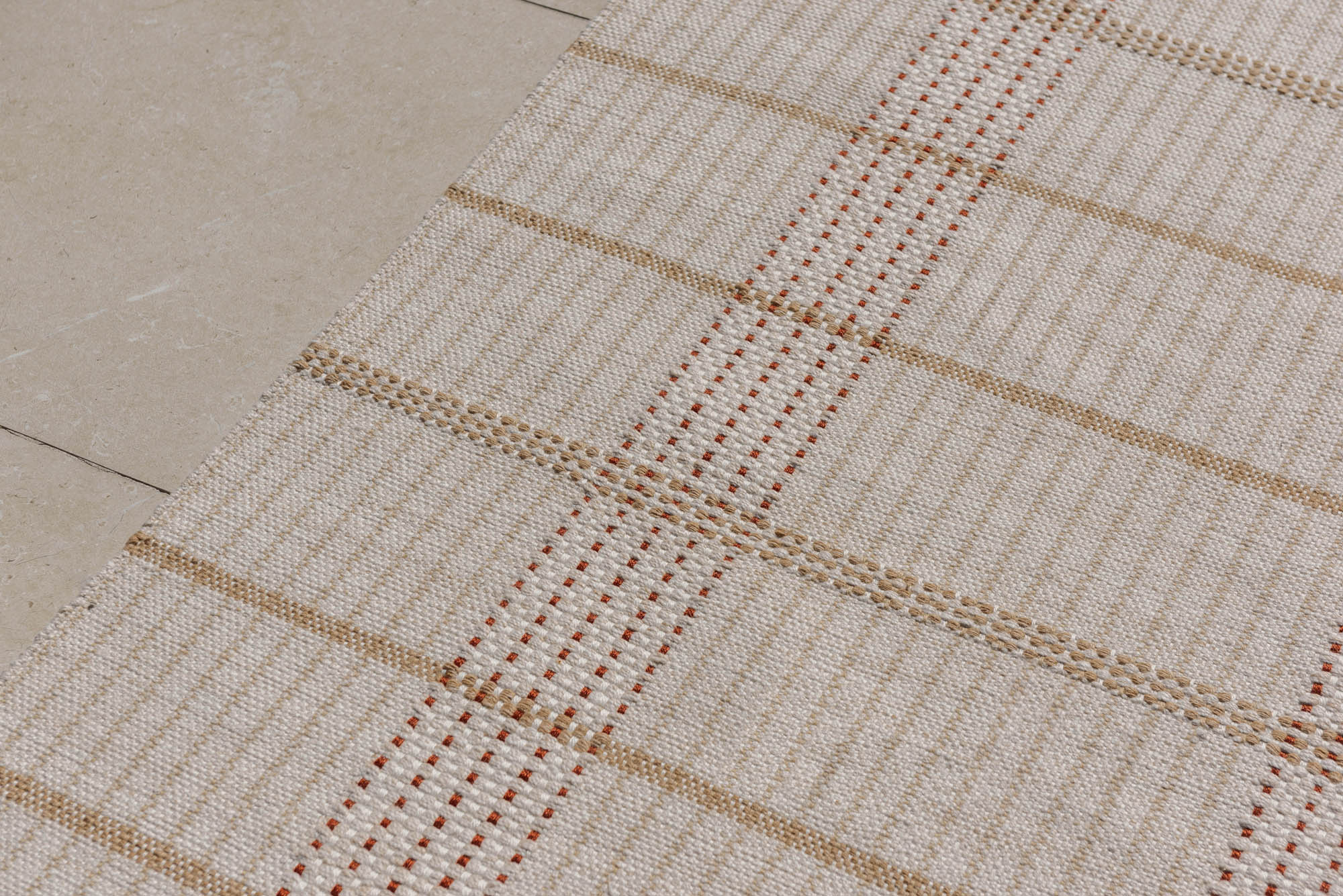 Modern beige geometric rug with brown pattern