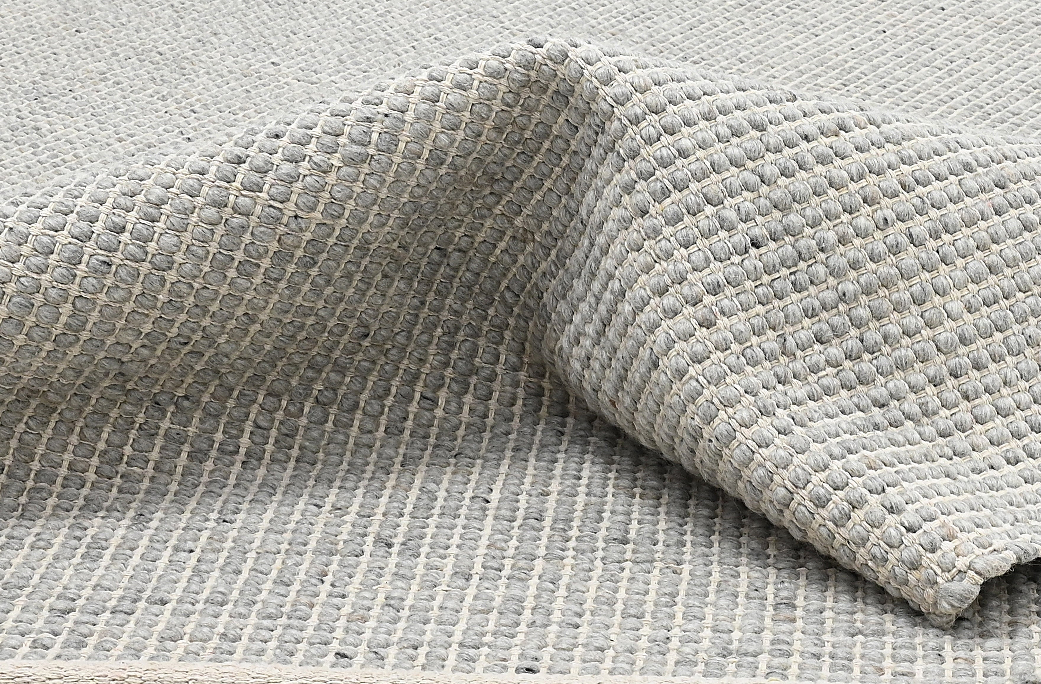 Textured wool grey area rug