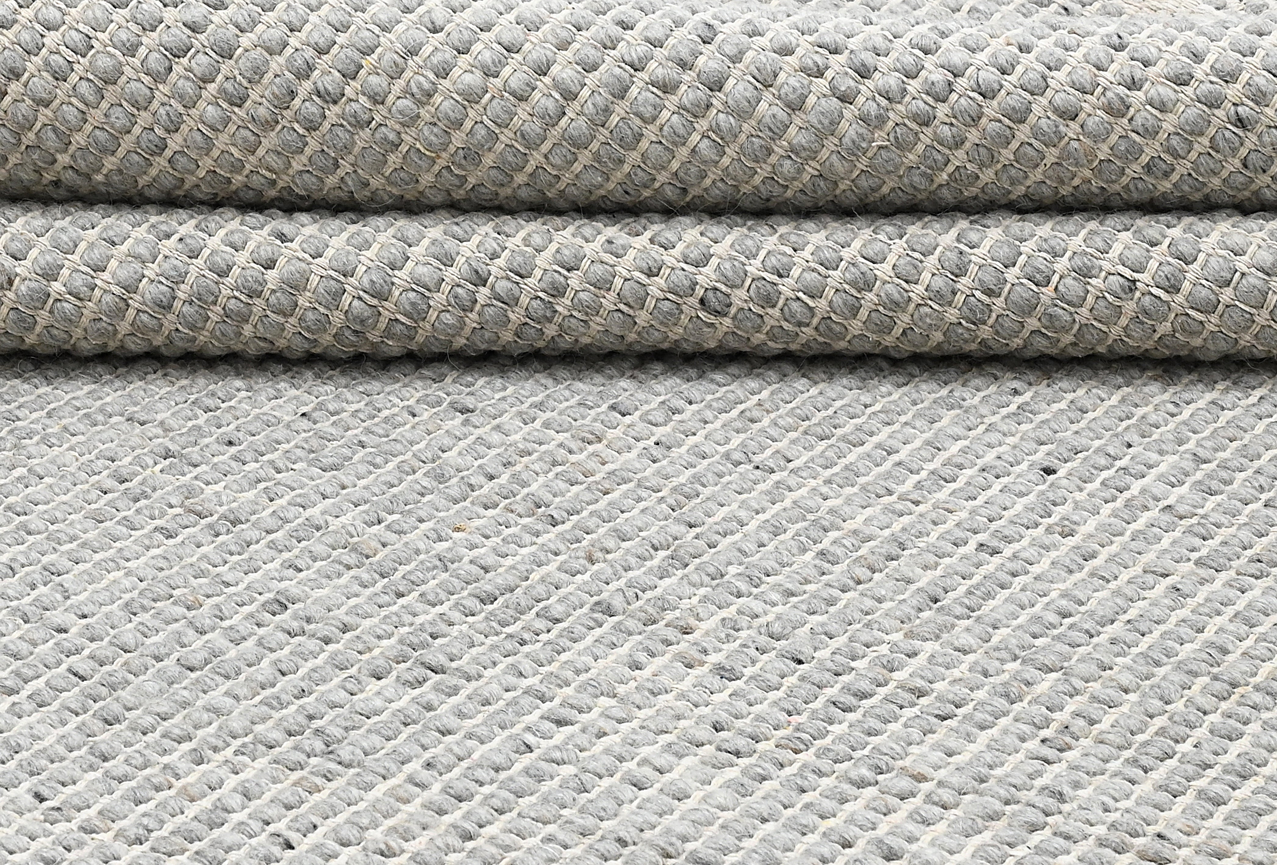 Textured wool grey area rug