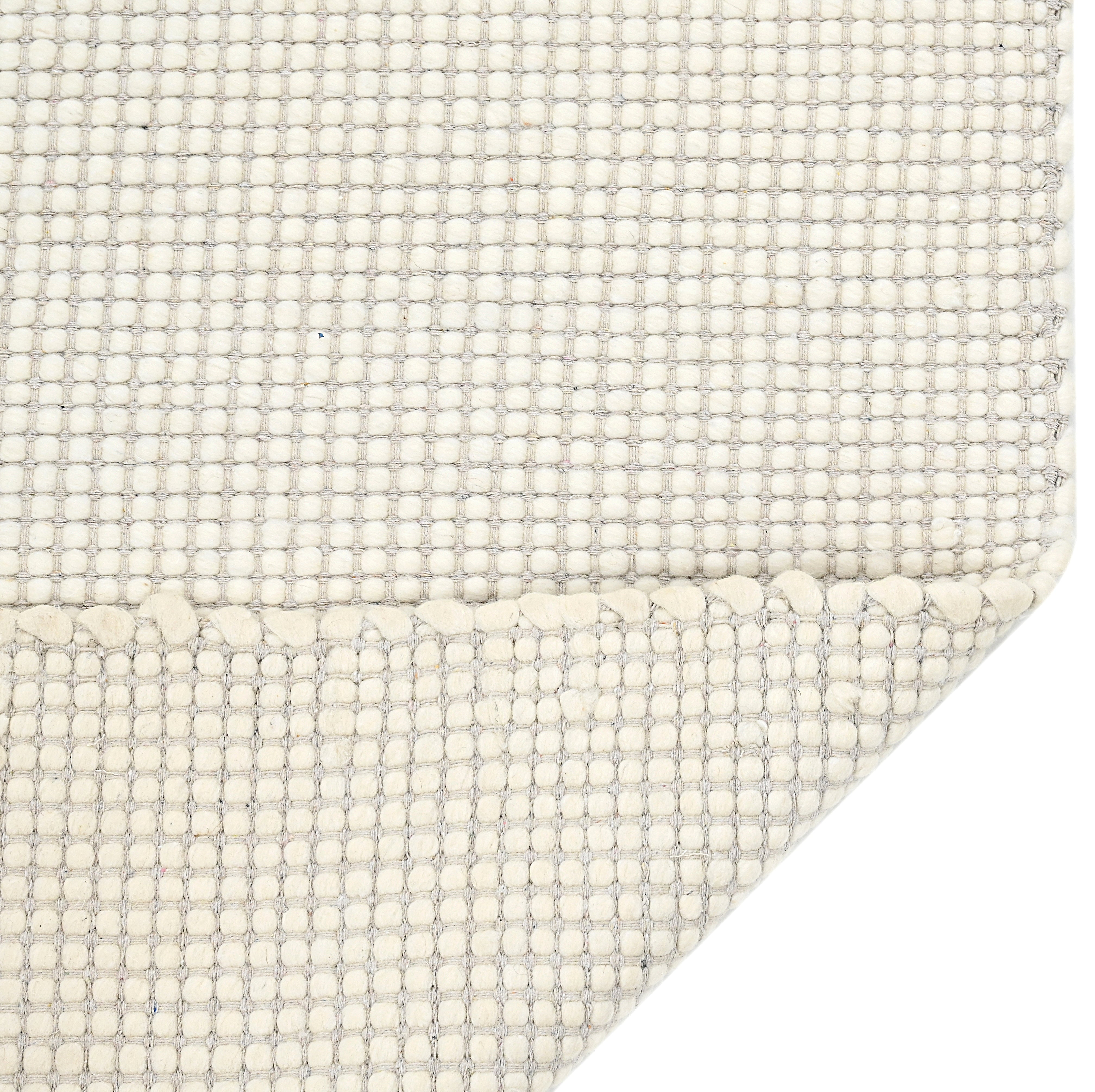 Textured wool white area rug