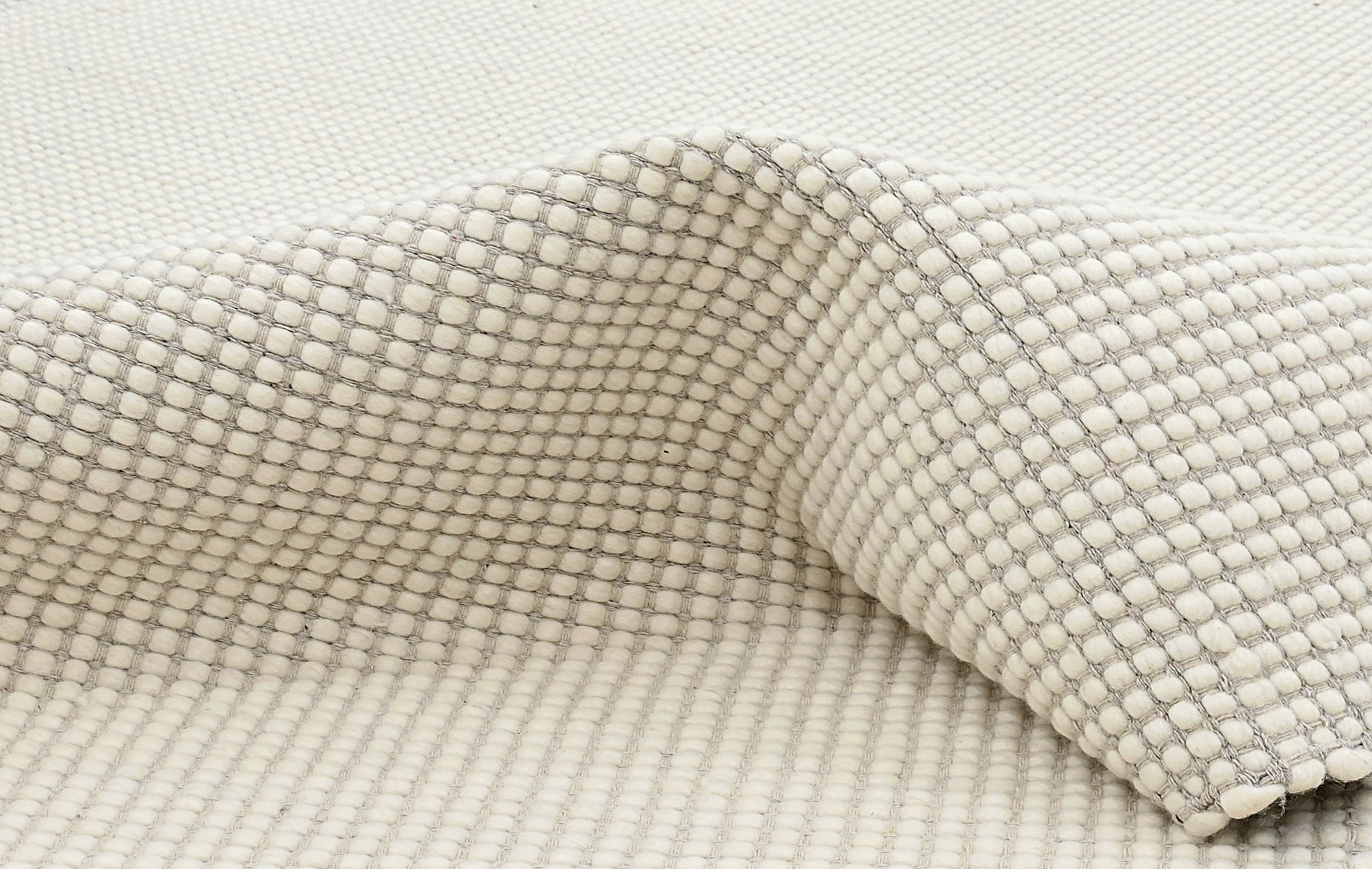 Textured wool white area rug
