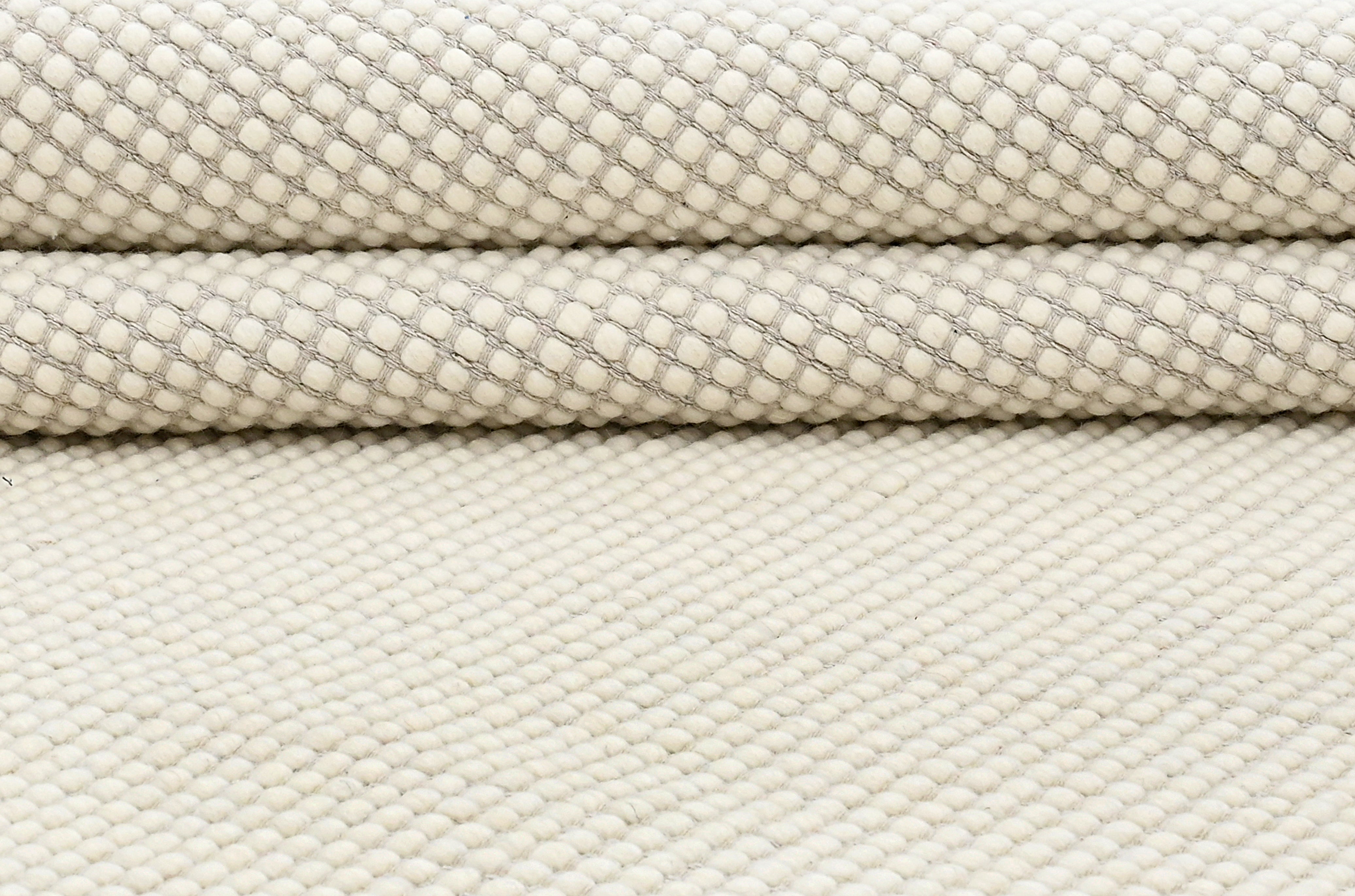 Textured wool white area rug