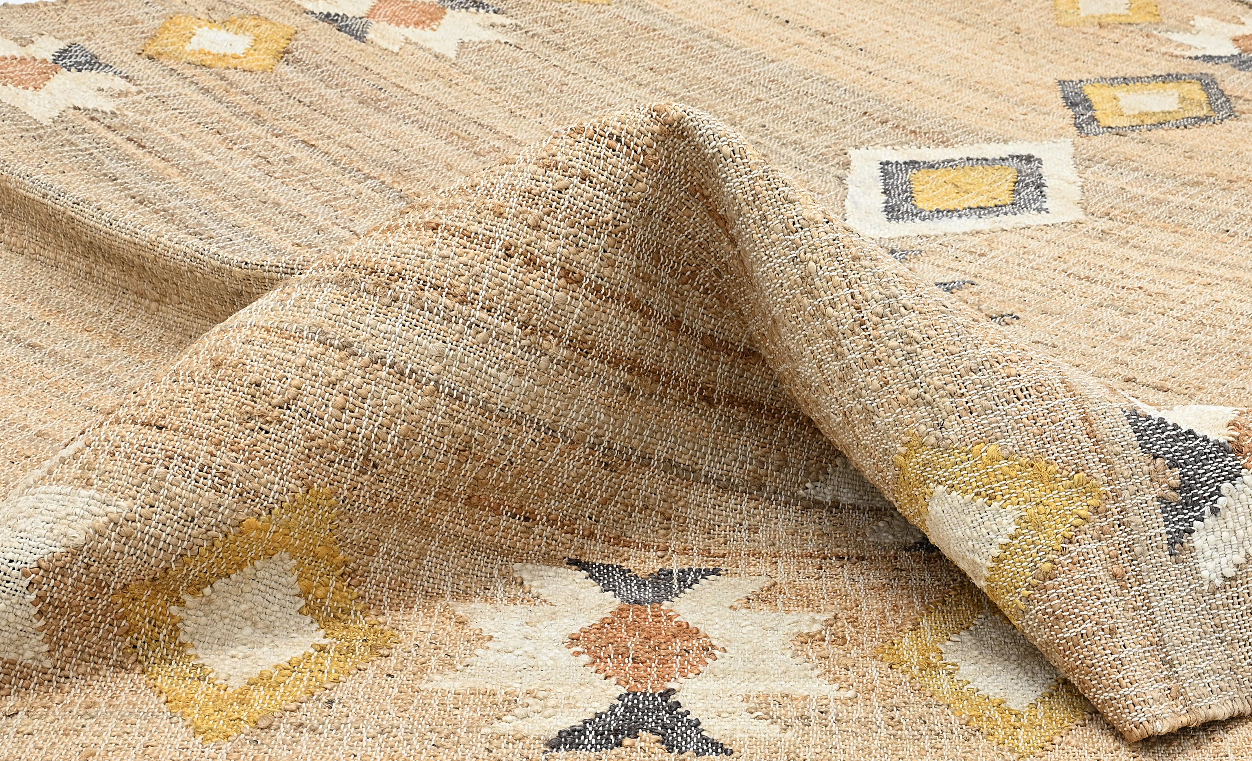 Jute rug with yellow, grey and terracotta geometric pattern