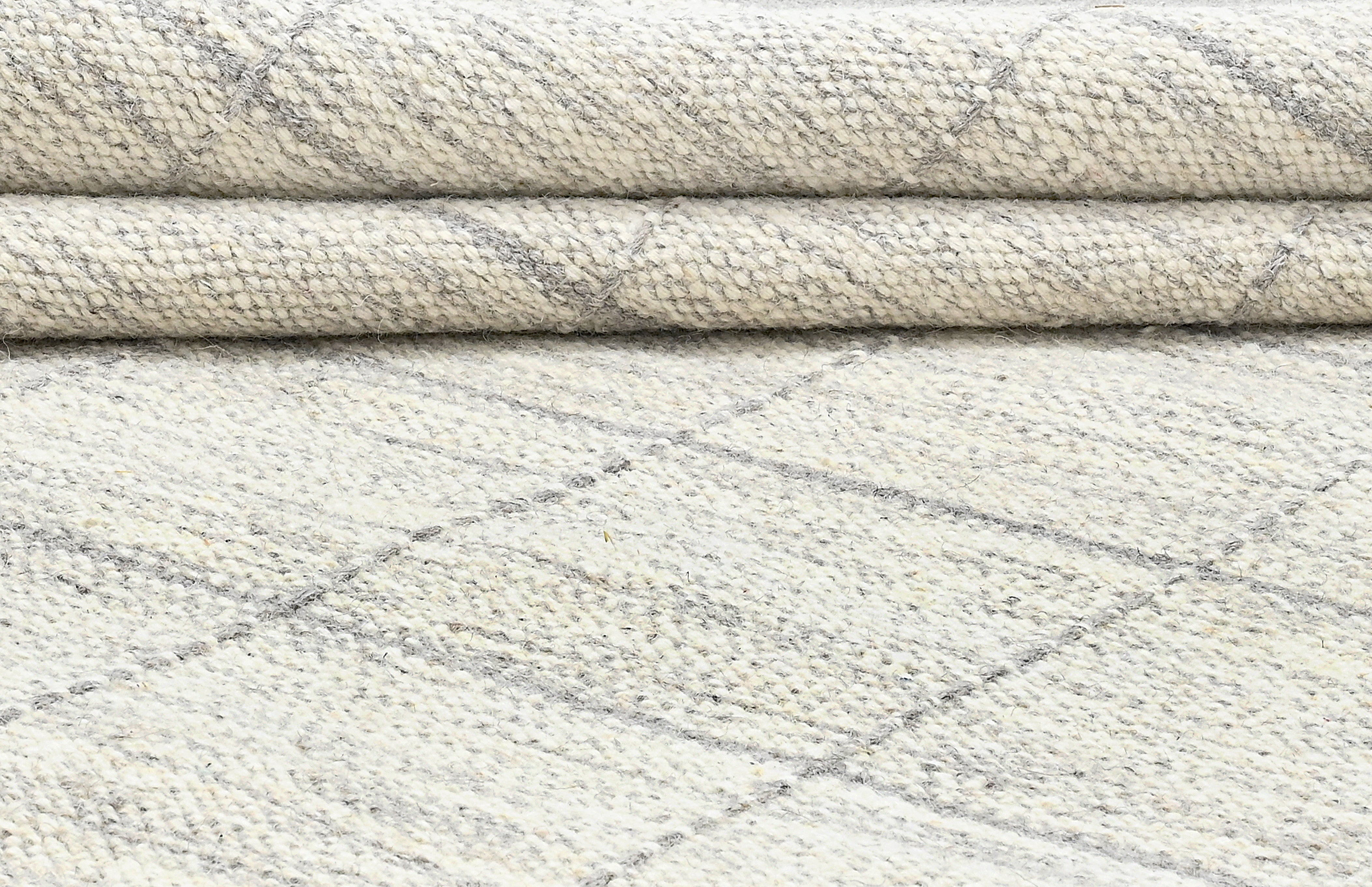 Beige neutral area rug with checkered design