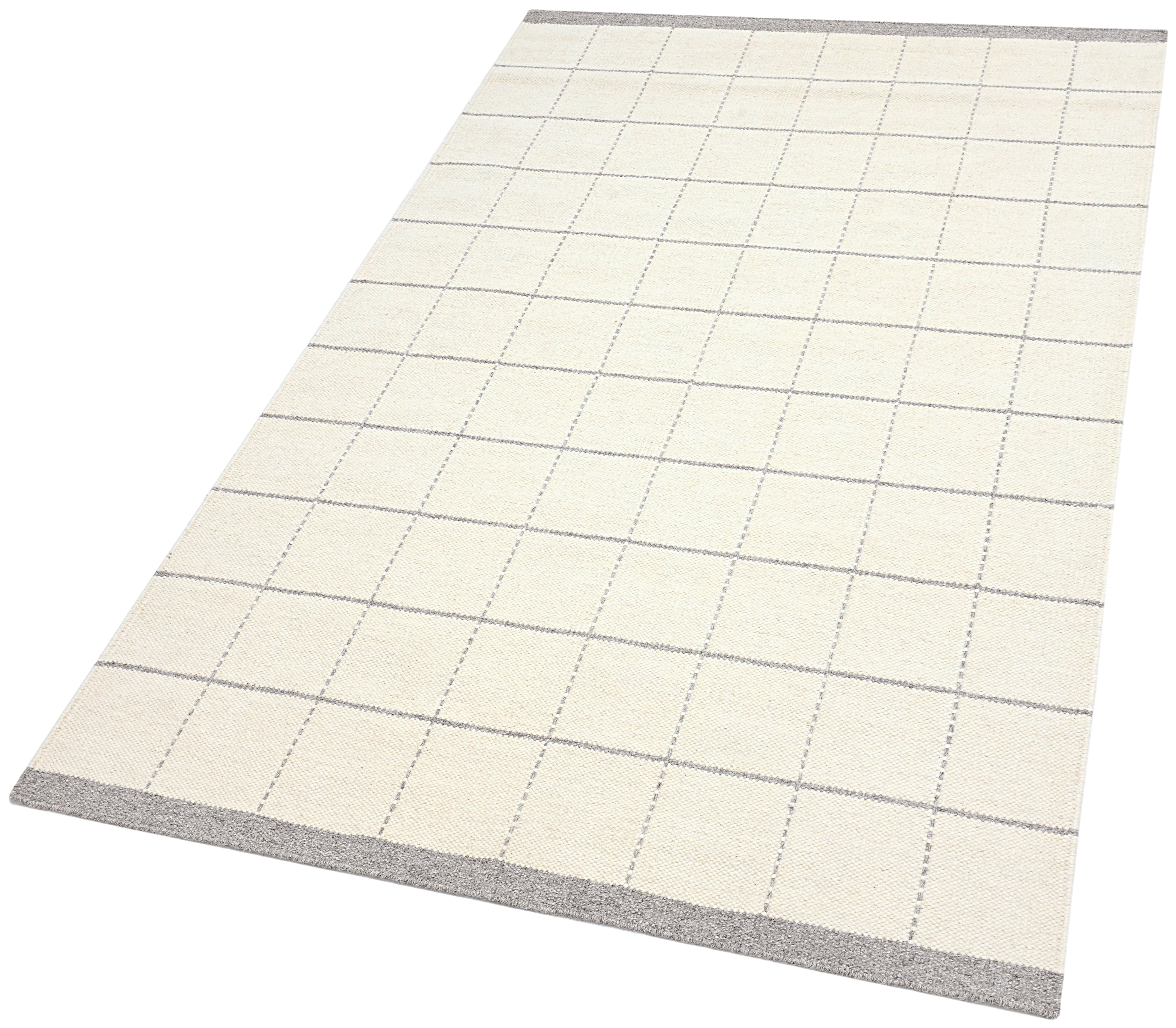 White wool and cotton area rug with grey checkered design