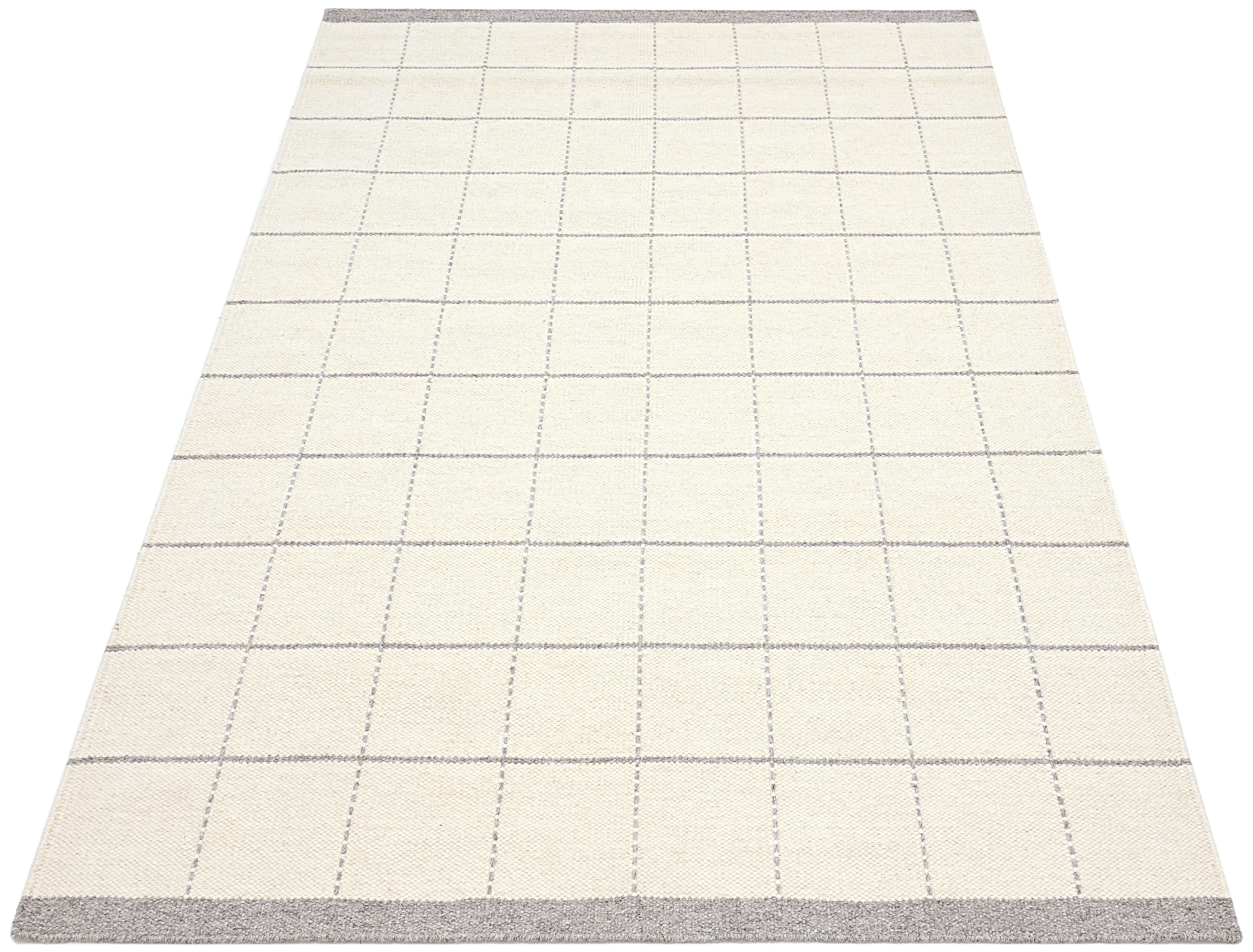 White wool and cotton area rug with grey checkered design