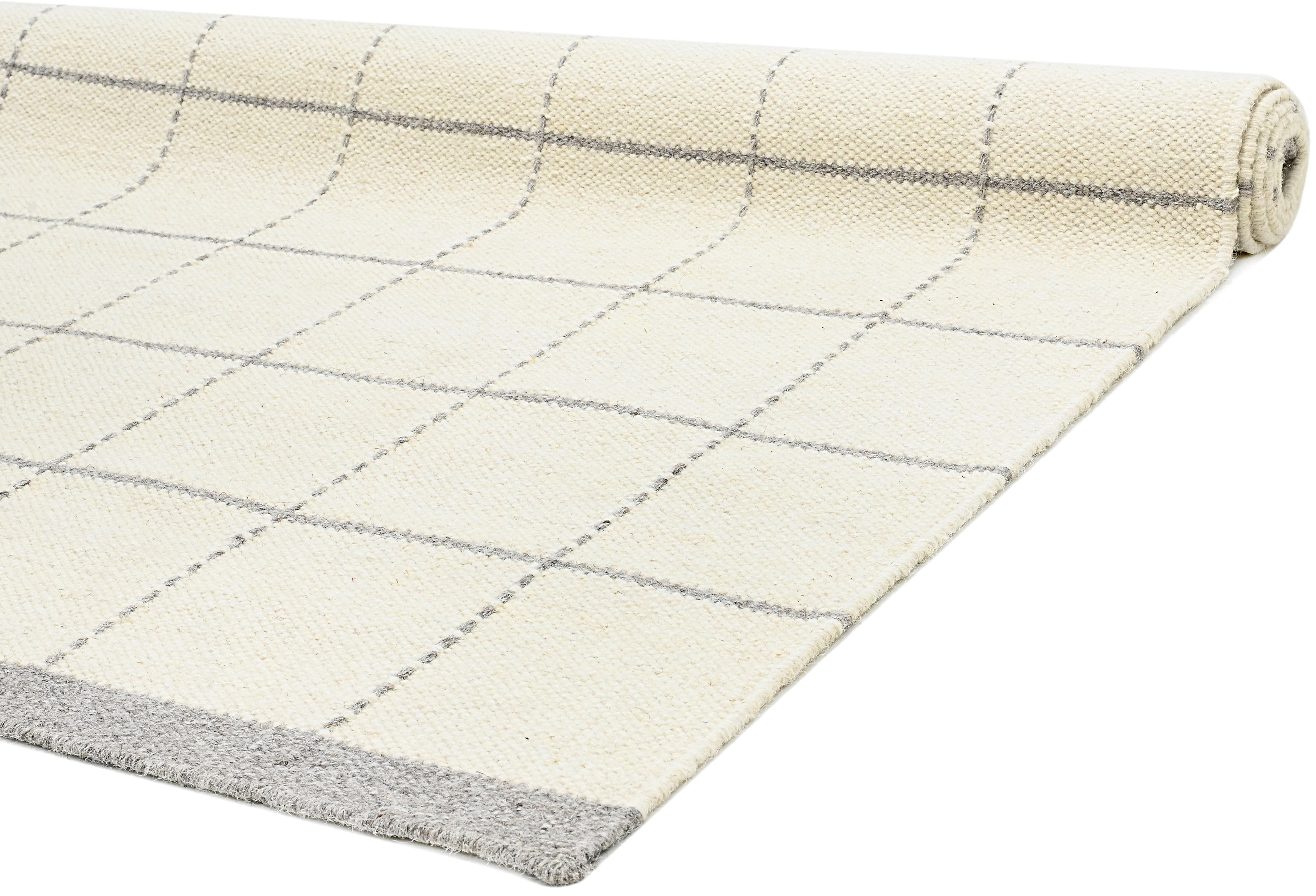 White wool and cotton area rug with grey checkered design