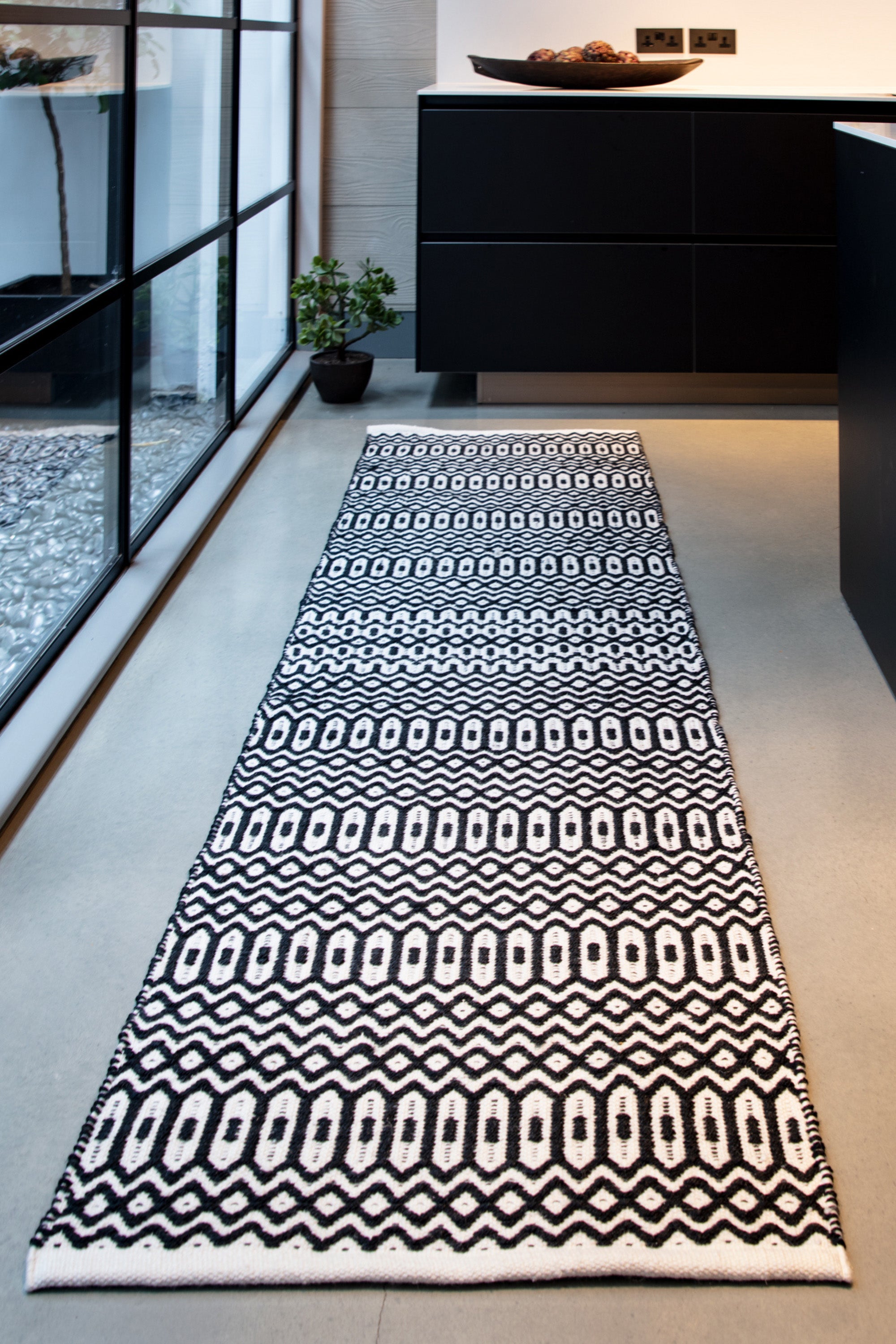 black indoor/outdoor runner with geometric design