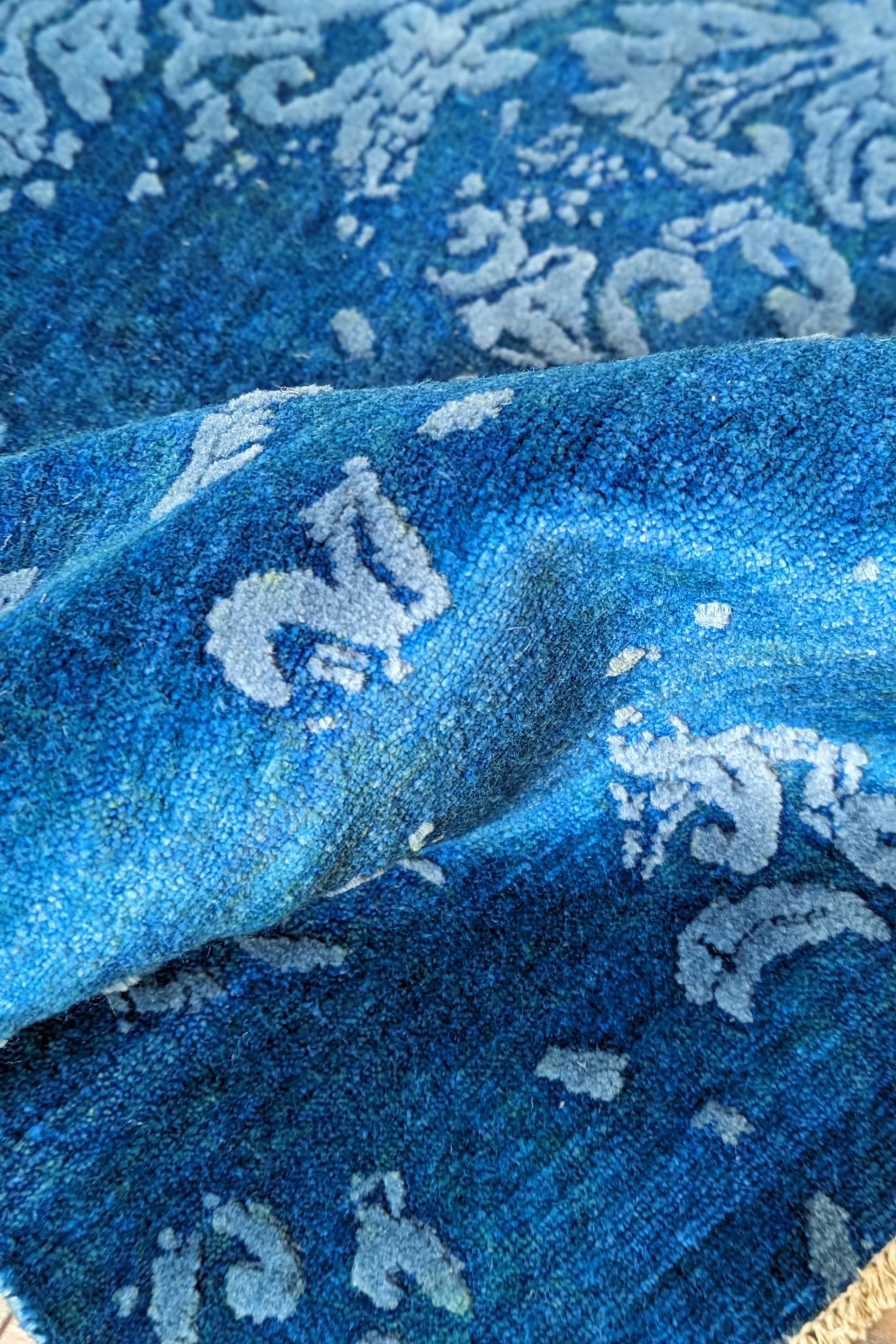 Authentic oriental rug with a damask pattern in beige