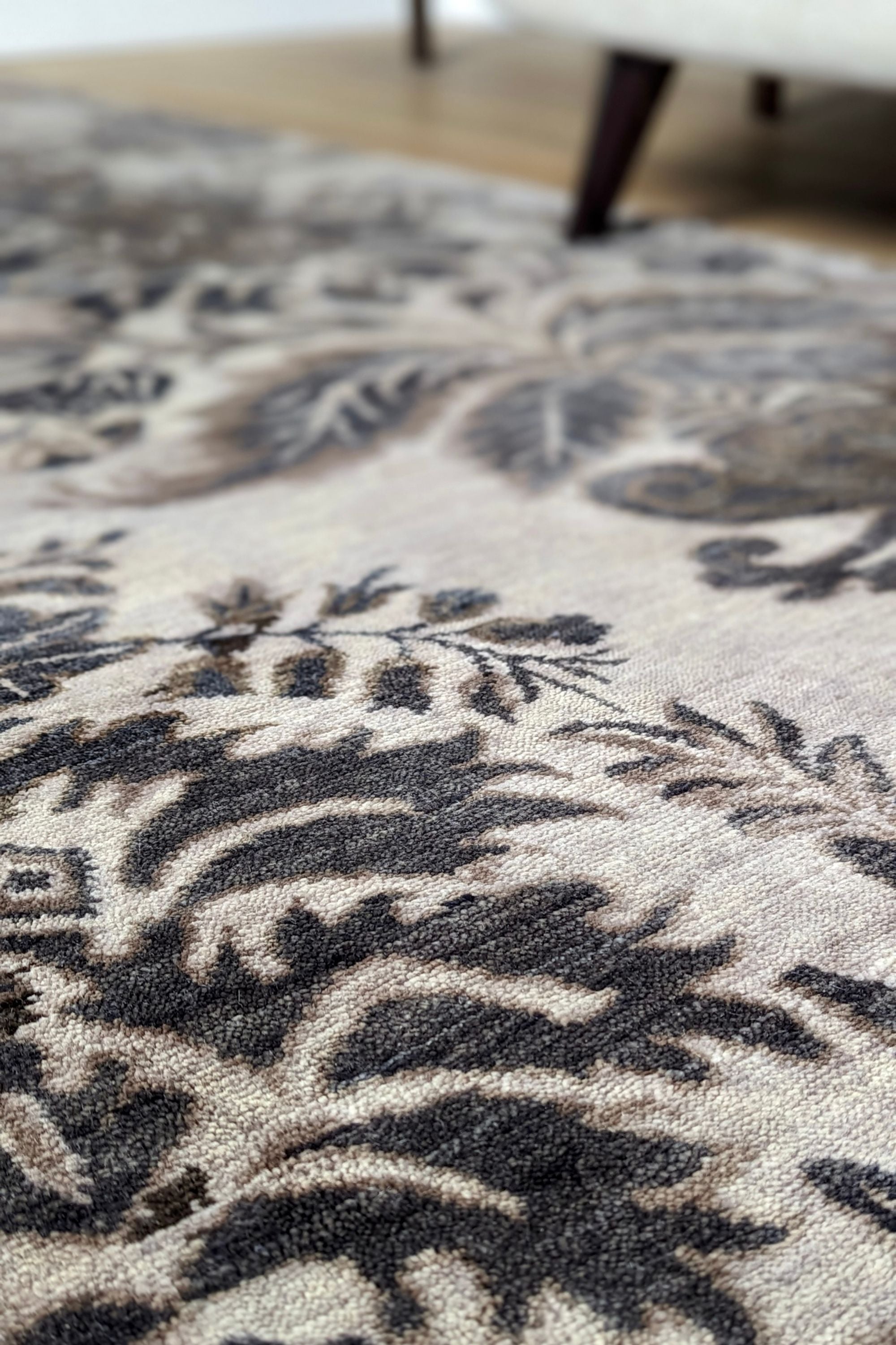 Authentic oriental rug with a damask pattern in beige and brown